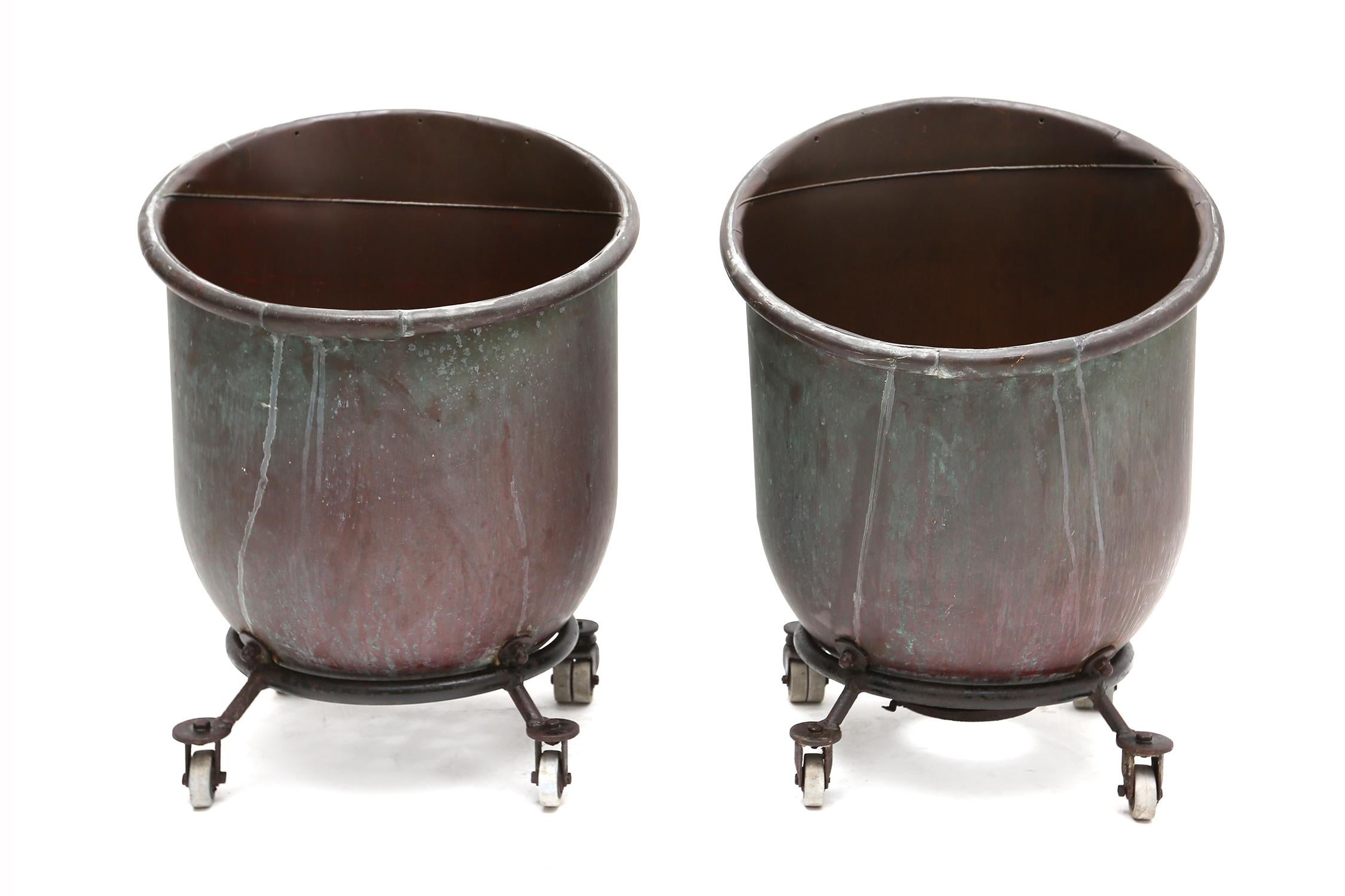 Industrial pair of bronze cachepots.

They're from our private collection and serve as planters.
Super unusual and decorative.
 