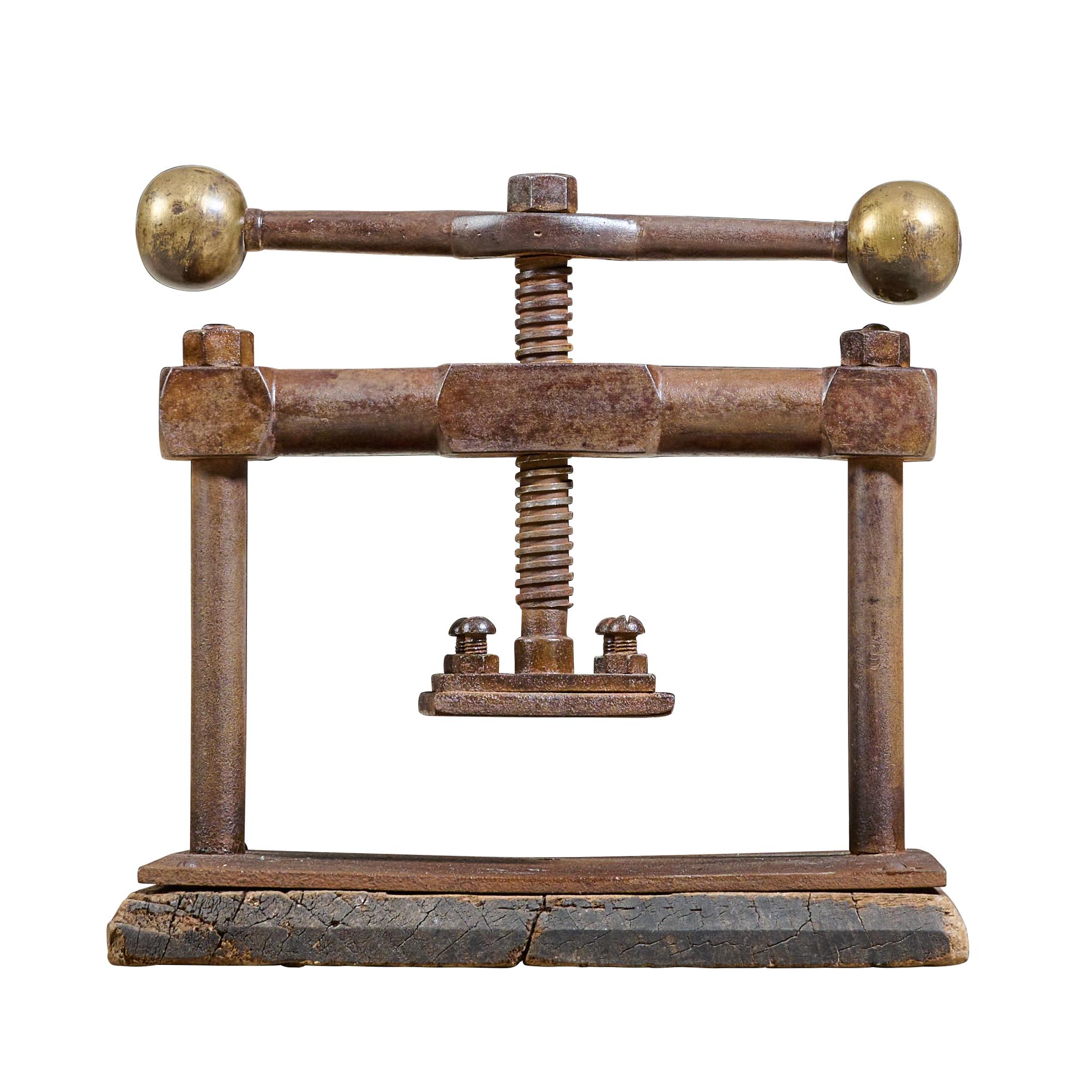 Cast iron, bronze and wood book press. Great design.

