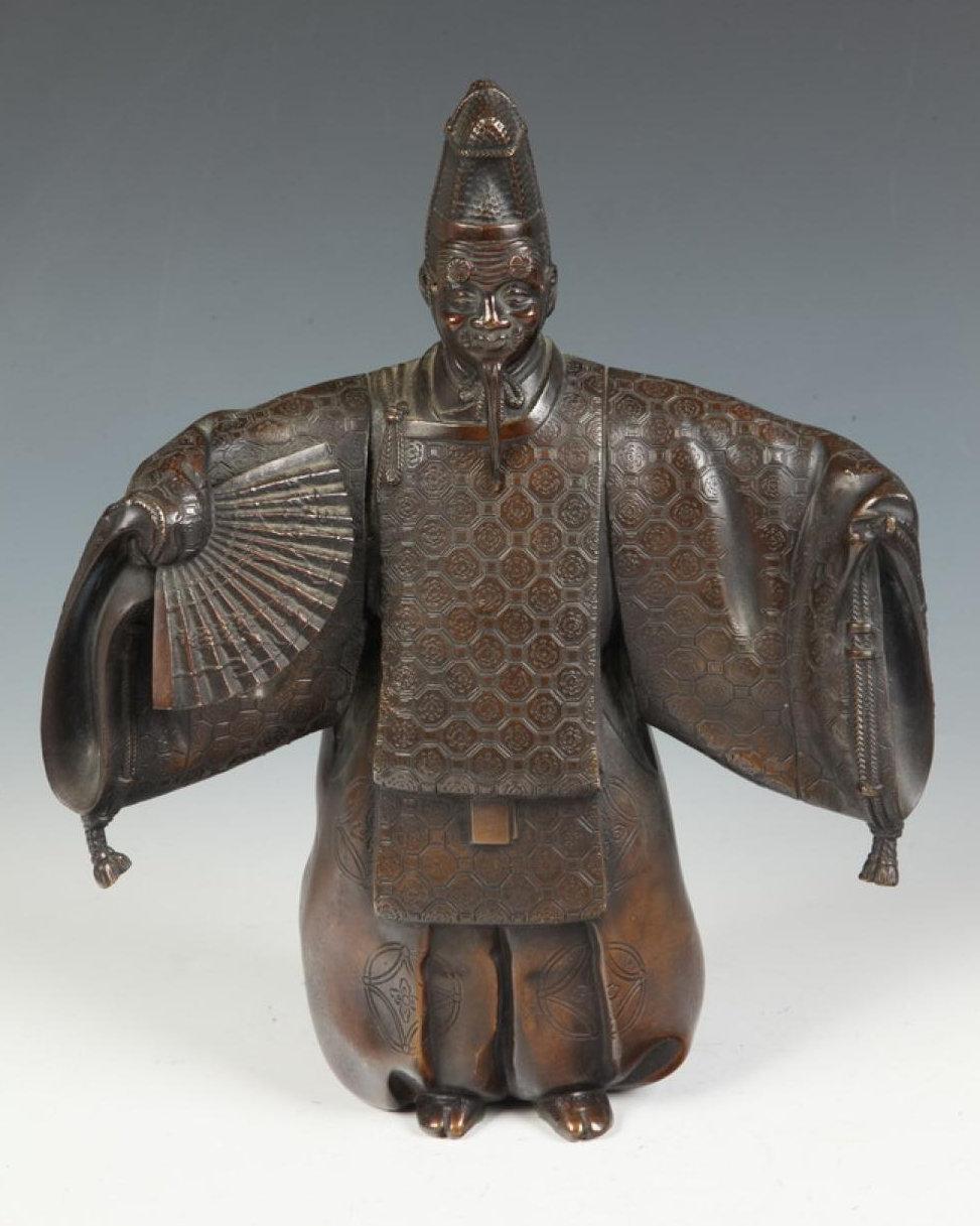 Our beautiful bronze sculpture depicts a Kabuki actor with removable mask. It has a warm brown patina and is in very good condition. Signed.