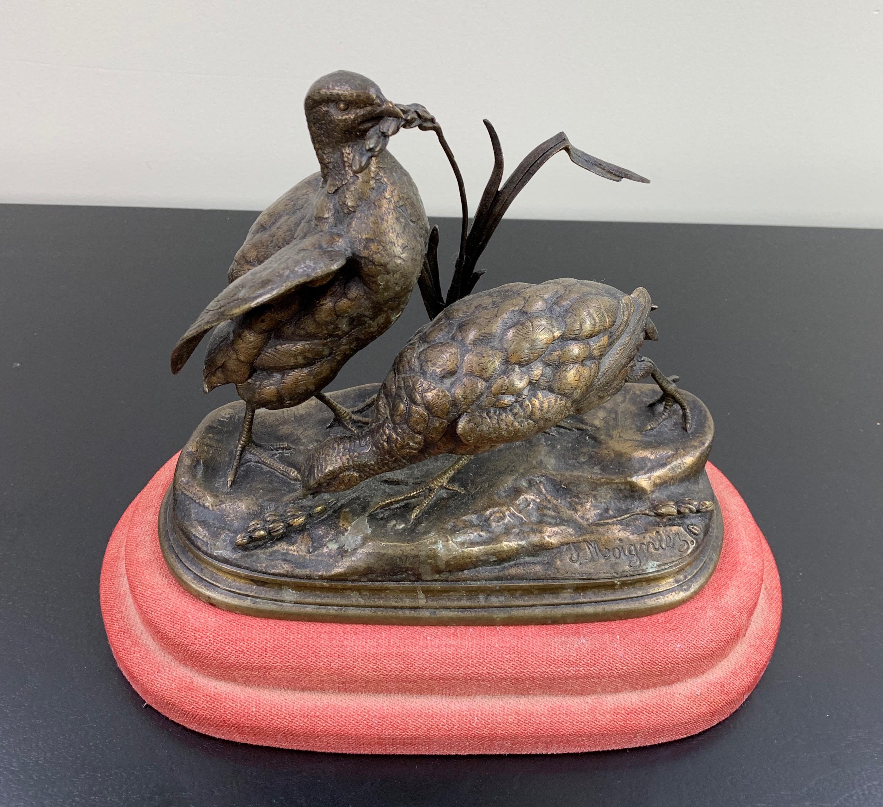 This wonderfully playful French animaliers study of two pheasants eating wheat has a nice golden patina and finely finished hand chased surface detail, raised on a naturalistic base and signed J Moigniez.