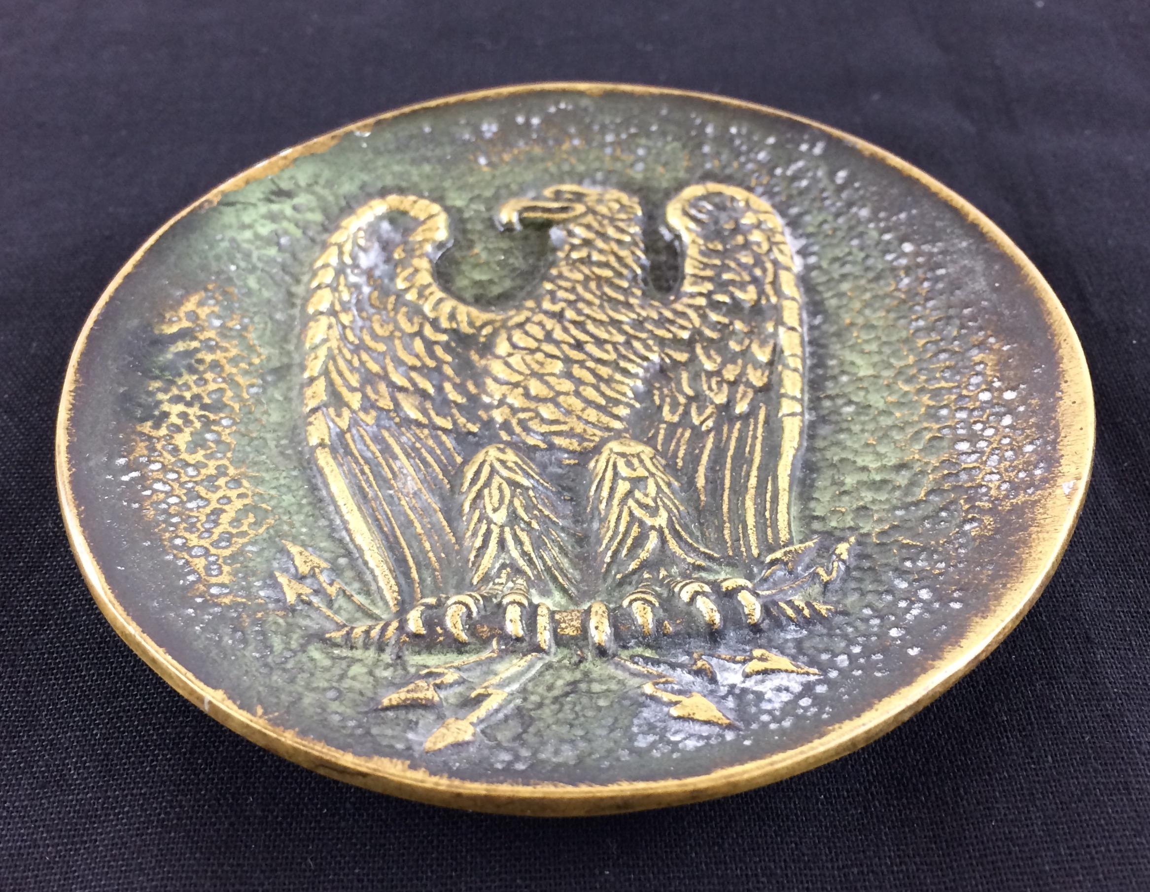 Bronze by Max Le Verrier that makes a great key holder/vide-poche. 

The Imperial Eagle motif on this heavy bronze piece is beautiful and displays very well on a desk or console near an entry. 

One of a series of bronze dishes sculpted and cast