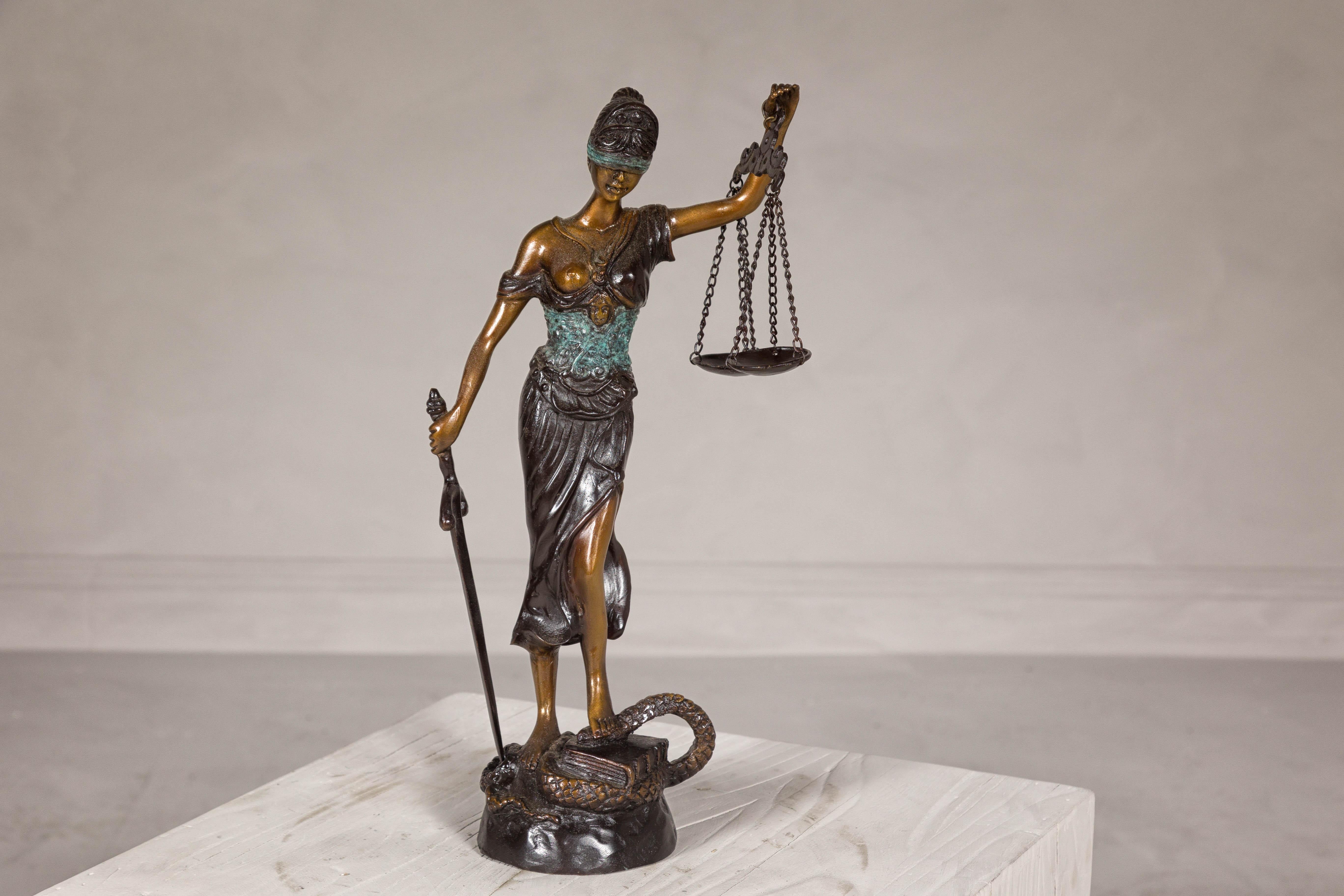 Lady Justice, a cast bronze tabletop statuette with scales and sword. This exquisite Lady Justice bronze statuette captures the timeless symbolism of impartiality and moral force within judicial systems. Crafted using the traditional lost wax cast