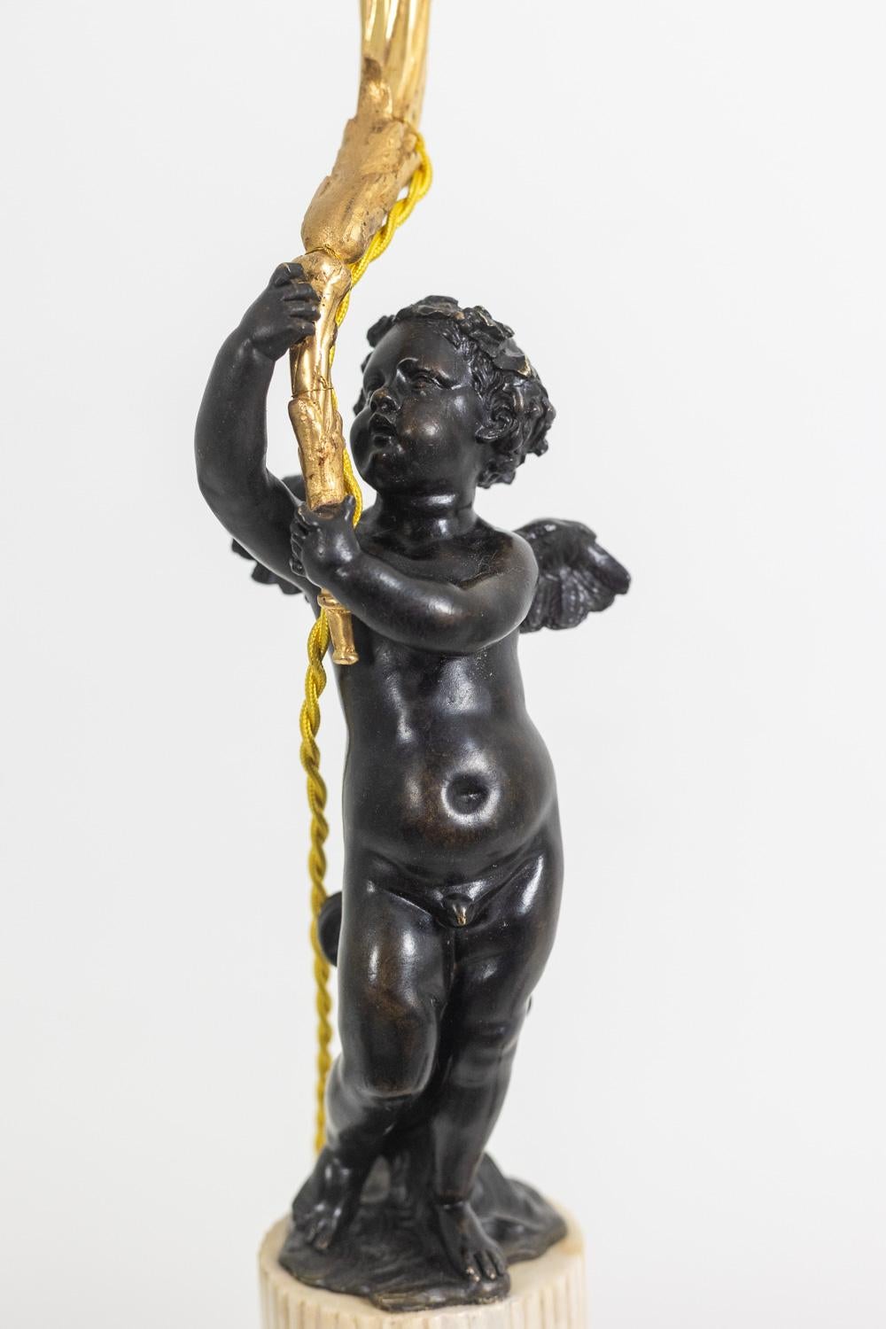 19th Century Bronze lamp representing a putti, marble base. Circa 1880. For Sale