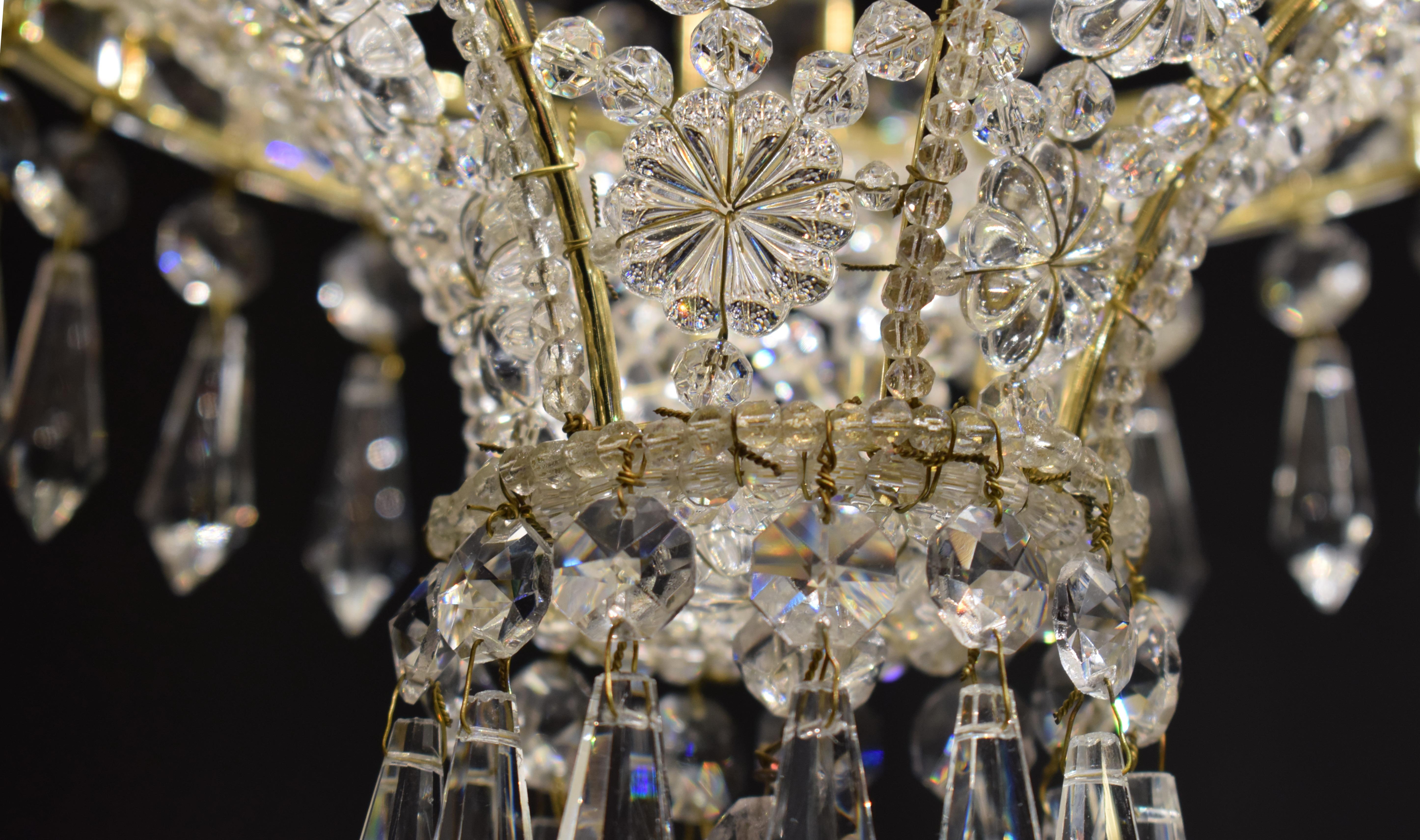 A very fine and Delicate Baltic Lantern. Silver over bronze frame and hand cut crystal beads, rosettes and U-drops. France, circa 1930. 1 light.
CW5031.