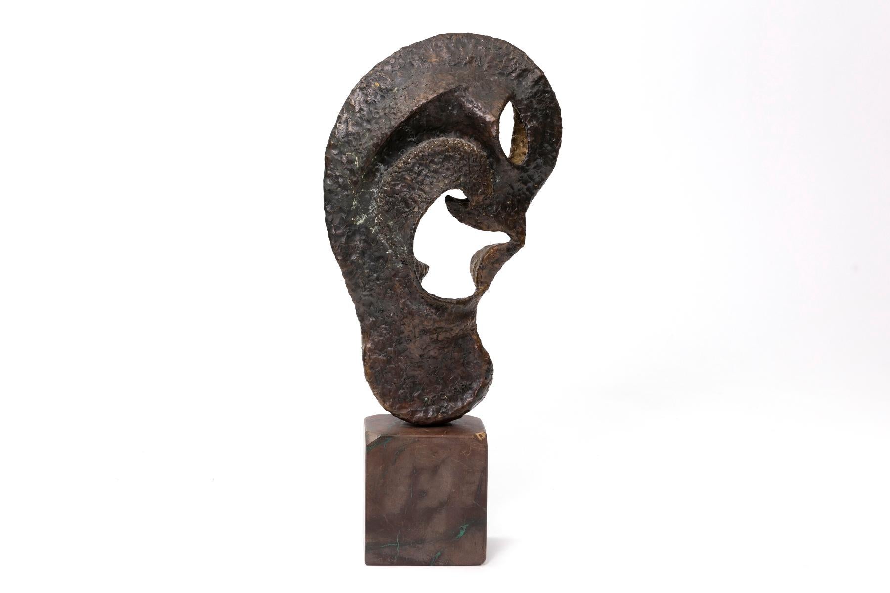 Large Scale pounded bronze ear sculpture mounted on marble by artist Robert Clark, of the duo Clark & (William) De Lillo. 

The costume jeweler and artist, Robert F. Clark, partnered with jeweler William De Lillo, to create their haute couture