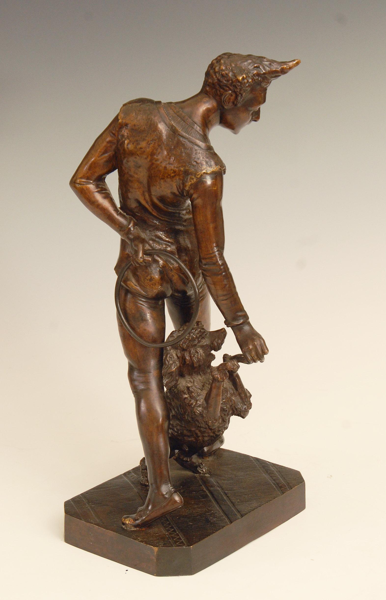Charming late 19th century French patinated bronze study of a clown playing with his performing poodle by George de Chemellier.

15.5 inches high, weighing approx 13 lbs / 6 kg.
Price includes free shipping to anywhere in the world.