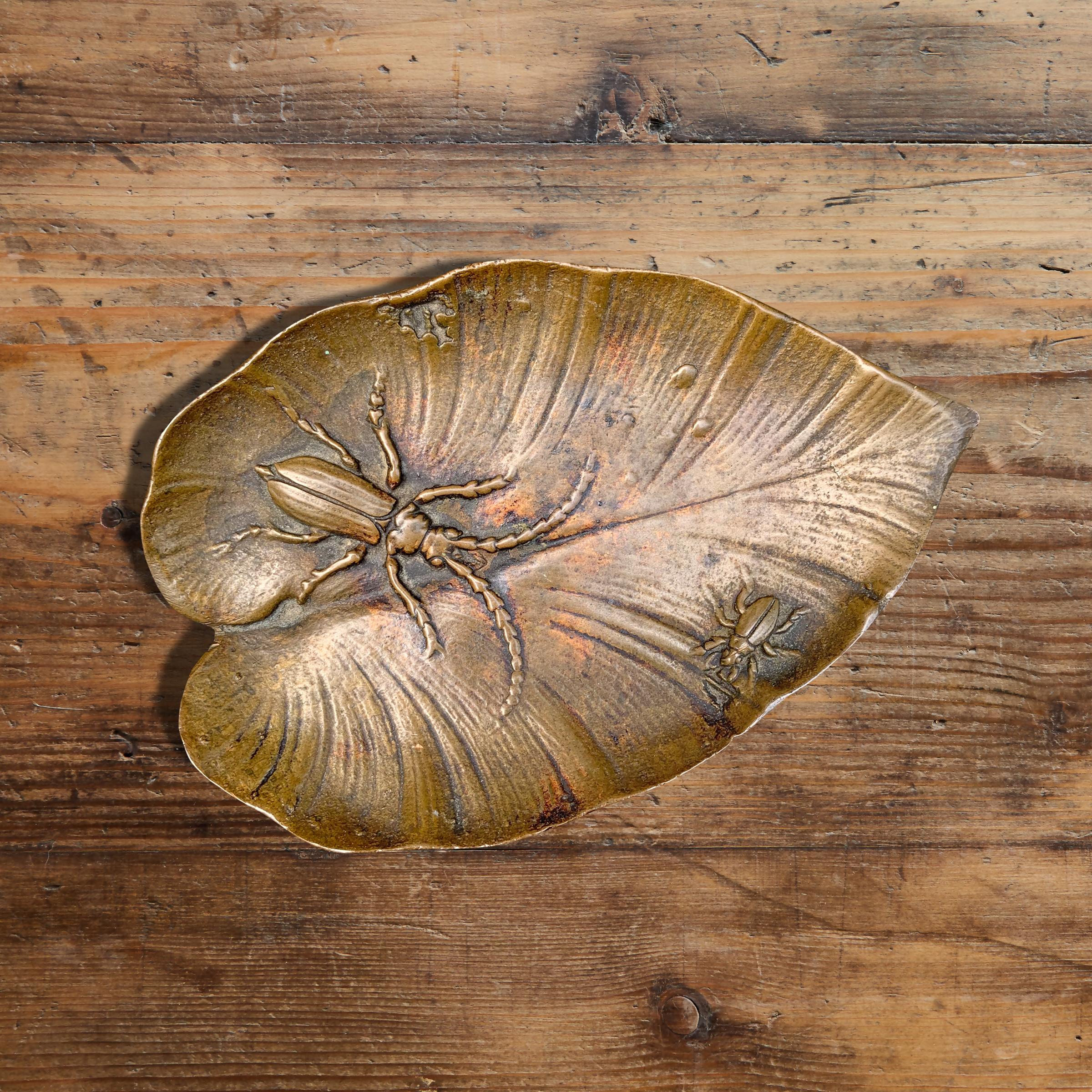 A wonderful early 20th century American bronze leaf dish with two beetles in low relief, cast by the American Art Bronze Foundry, a Chicago based foundry famous for casting many important public monuments that are scattered throughout the country.