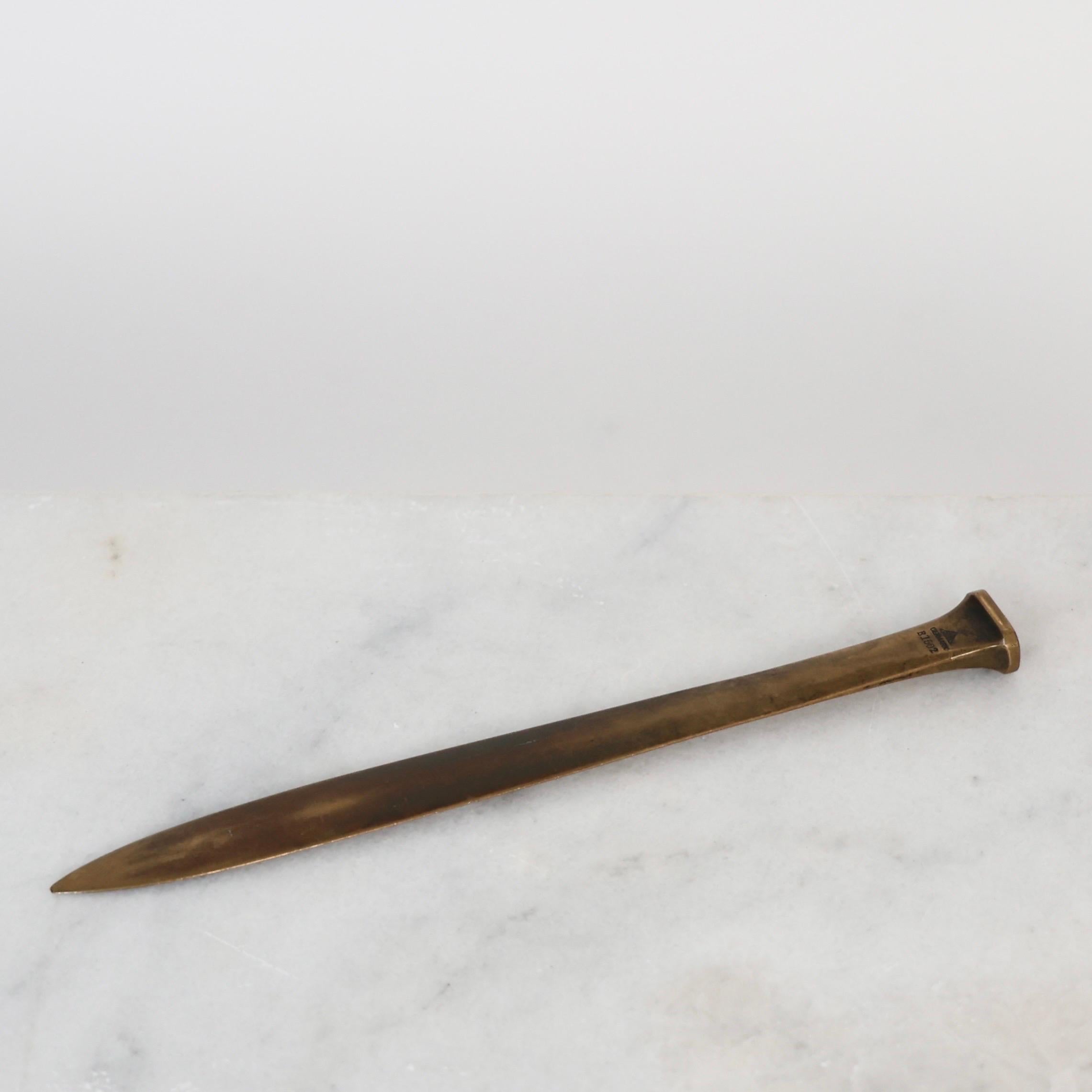 Large Bronze Letter Opener designed by Just Andersen in the 1930s. 

* Bronze letter knife
* Designer: Just Andersen
* Model: B1502
* Year: 1934
* Condition: Good vintage condition. Makers mark intact. Beautiful patina with only few marks and small