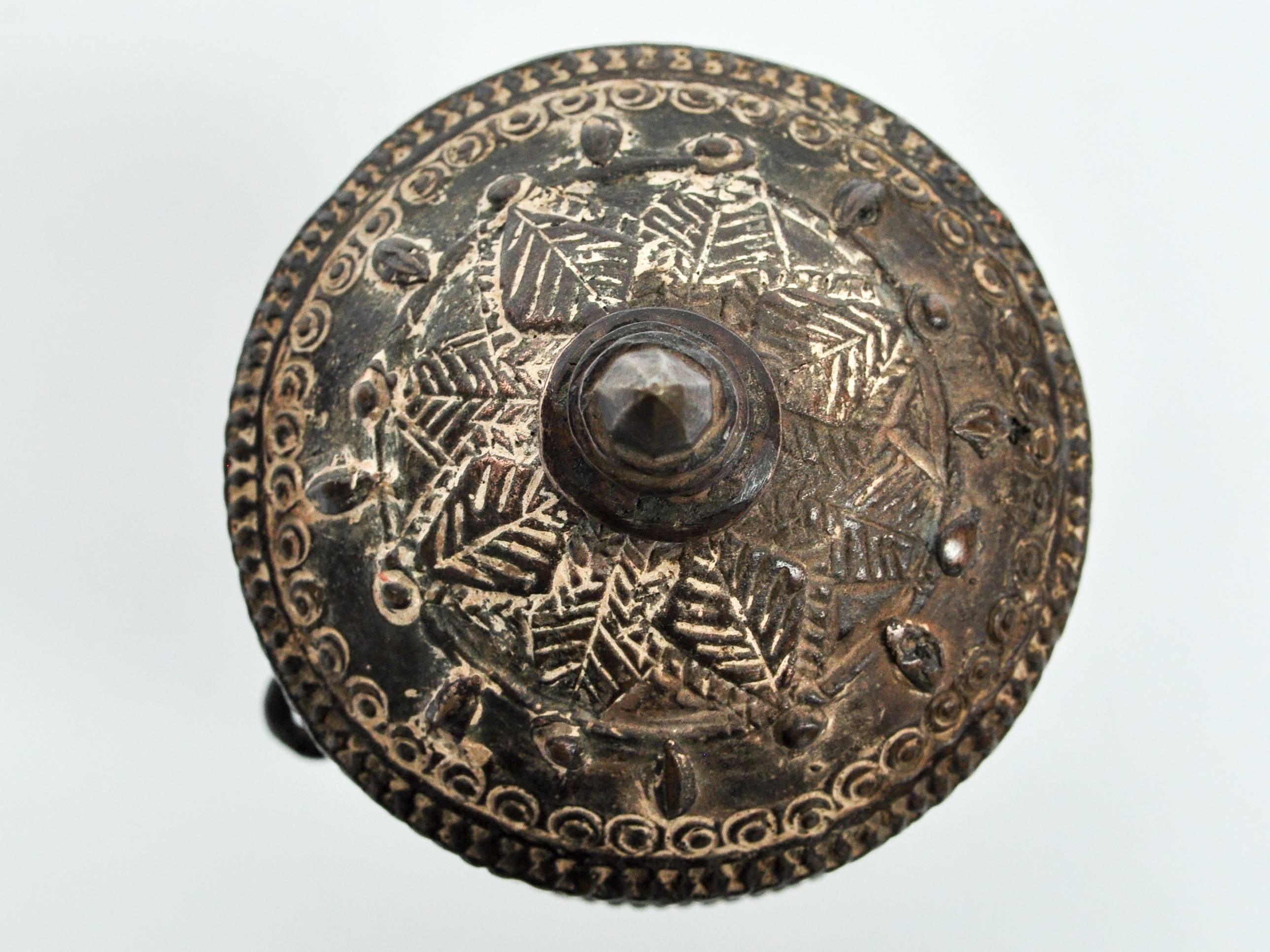 Bronze lime container from Laos, mid-20th century.
This bronze lime container is from the Lao Theung of Laos, a collection of Mon-Khumer speaking peoples who make up roughly a quarter of the country's population. Slaked lime is, along with the areca