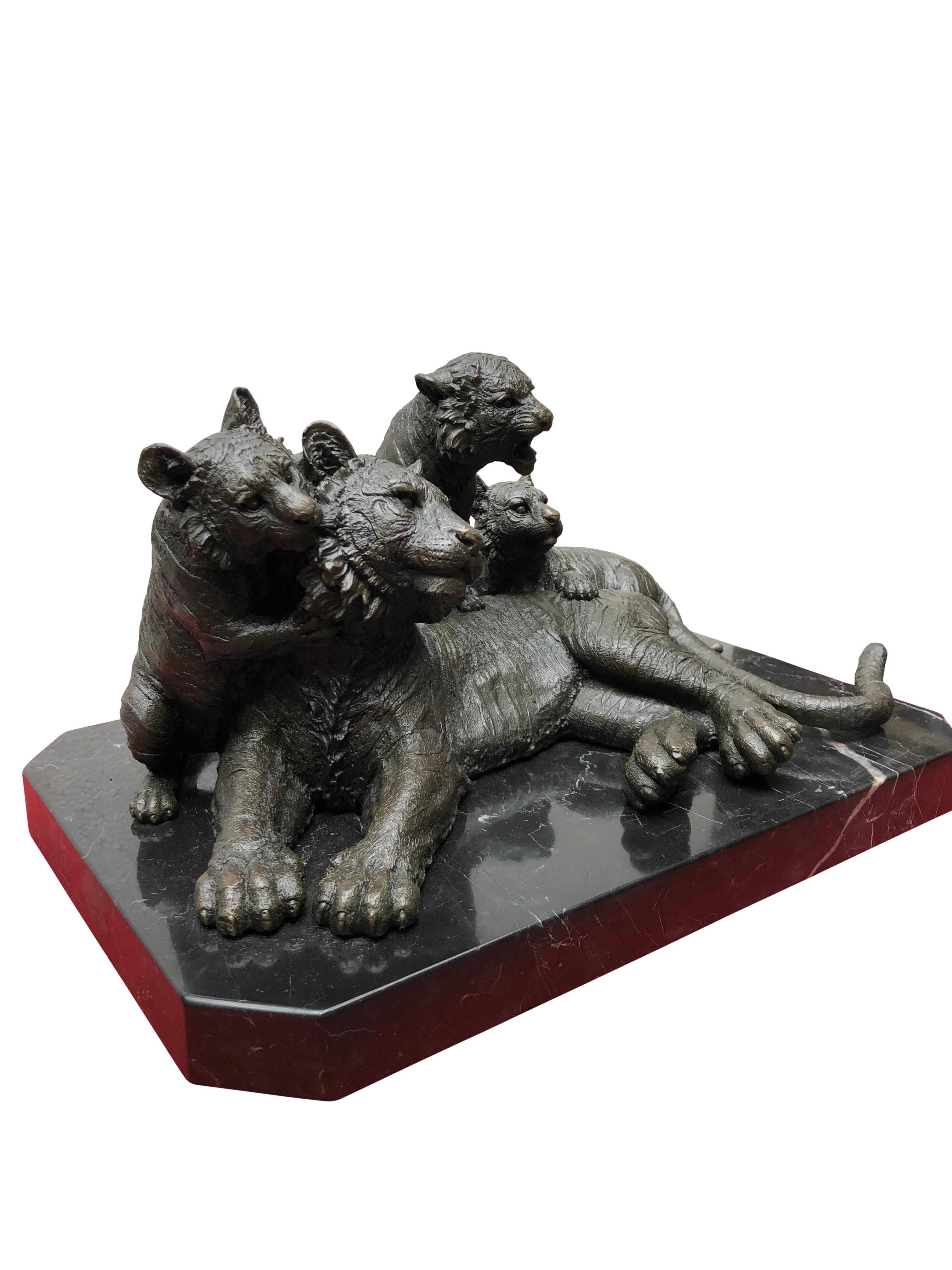 A gorgeous bronze casting of a tiger and her three cubs. Artist has really captured the energy to the scene with great skill. Stands on the black marble base which is smooth and chip free. Offered in excellent shape ready for home use right away.