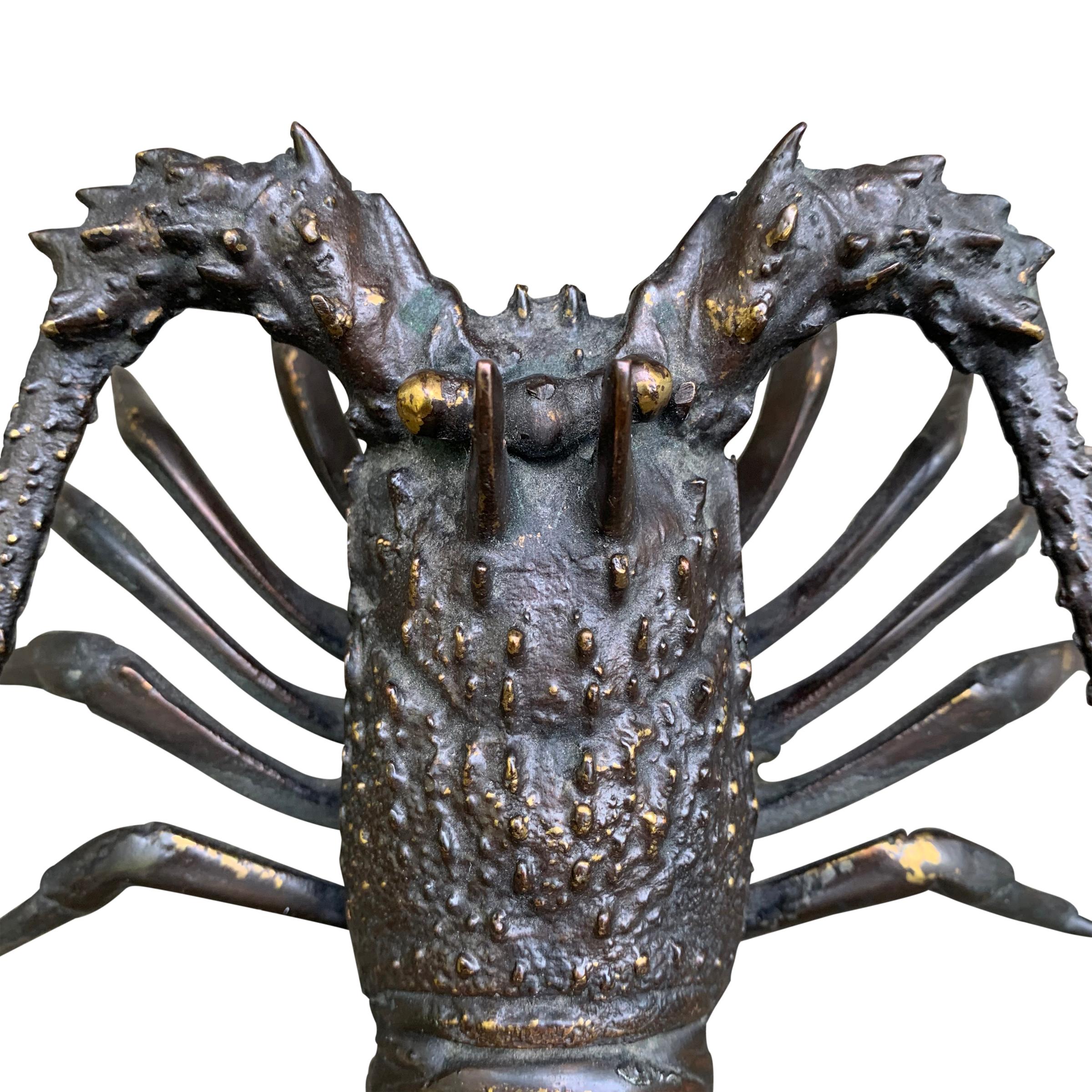 A whimsical bronze lobster, probably cast from life, with a wonderful patina, and an attached loop for hanging on a wall. Can be displayed on a tabletop as well.