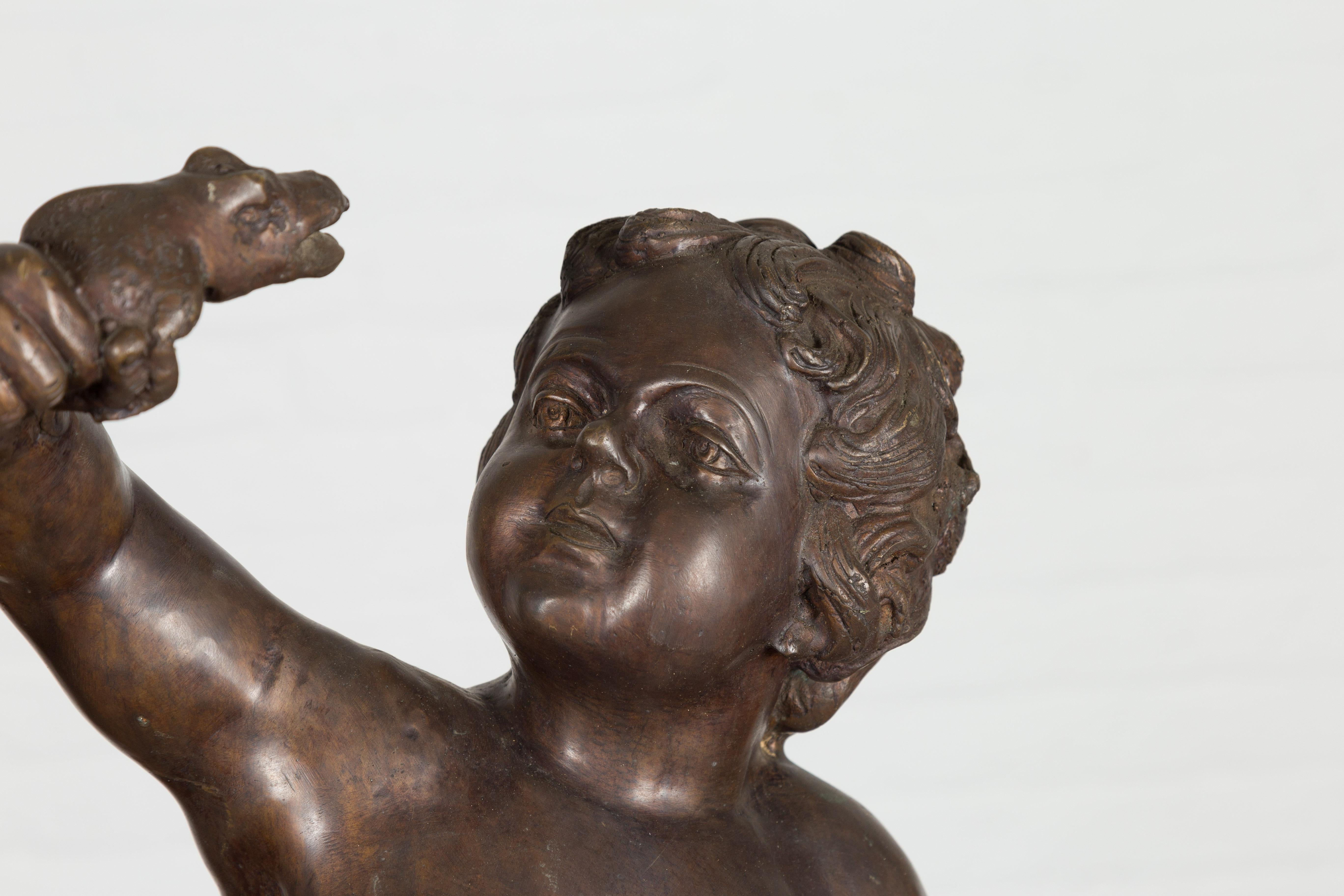 Cast Classical Bronze Tabletop Statue of a Putto Holding a Frog For Sale