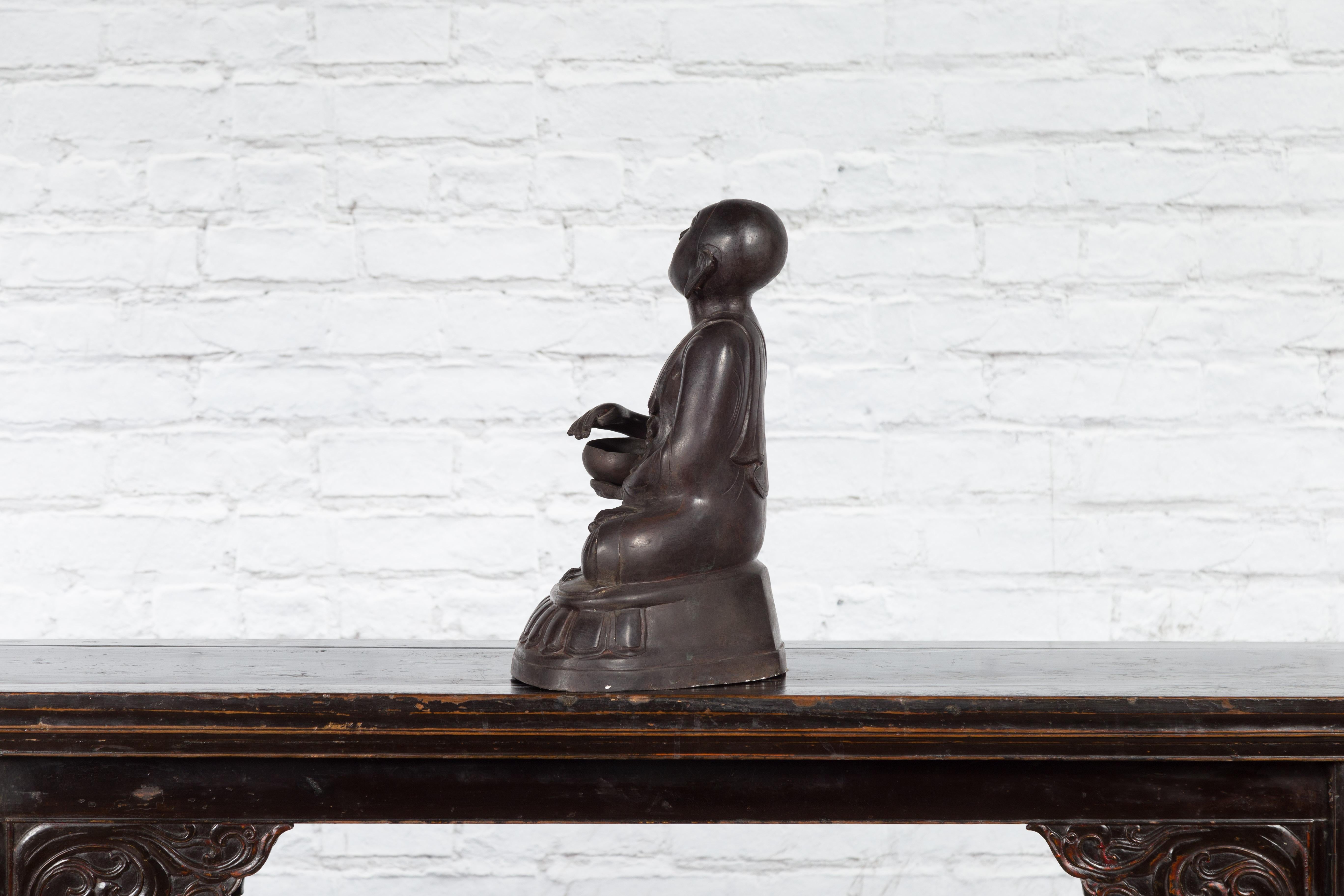 Bronze Lost Wax Sculpture Depicting a Praying Buddhist Monk with Offering Bowl For Sale 8