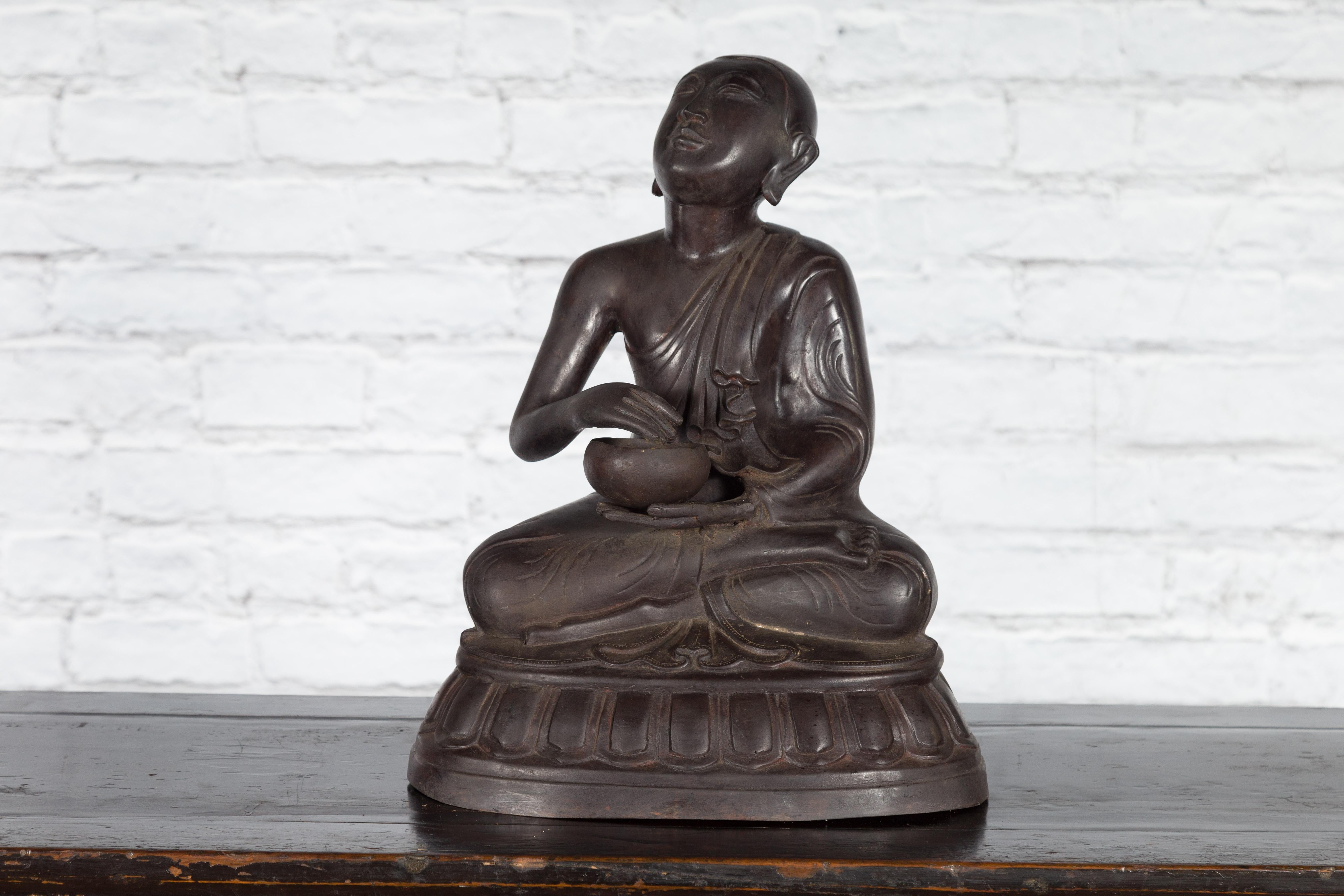 Cast Bronze Lost Wax Sculpture Depicting a Praying Buddhist Monk with Offering Bowl For Sale