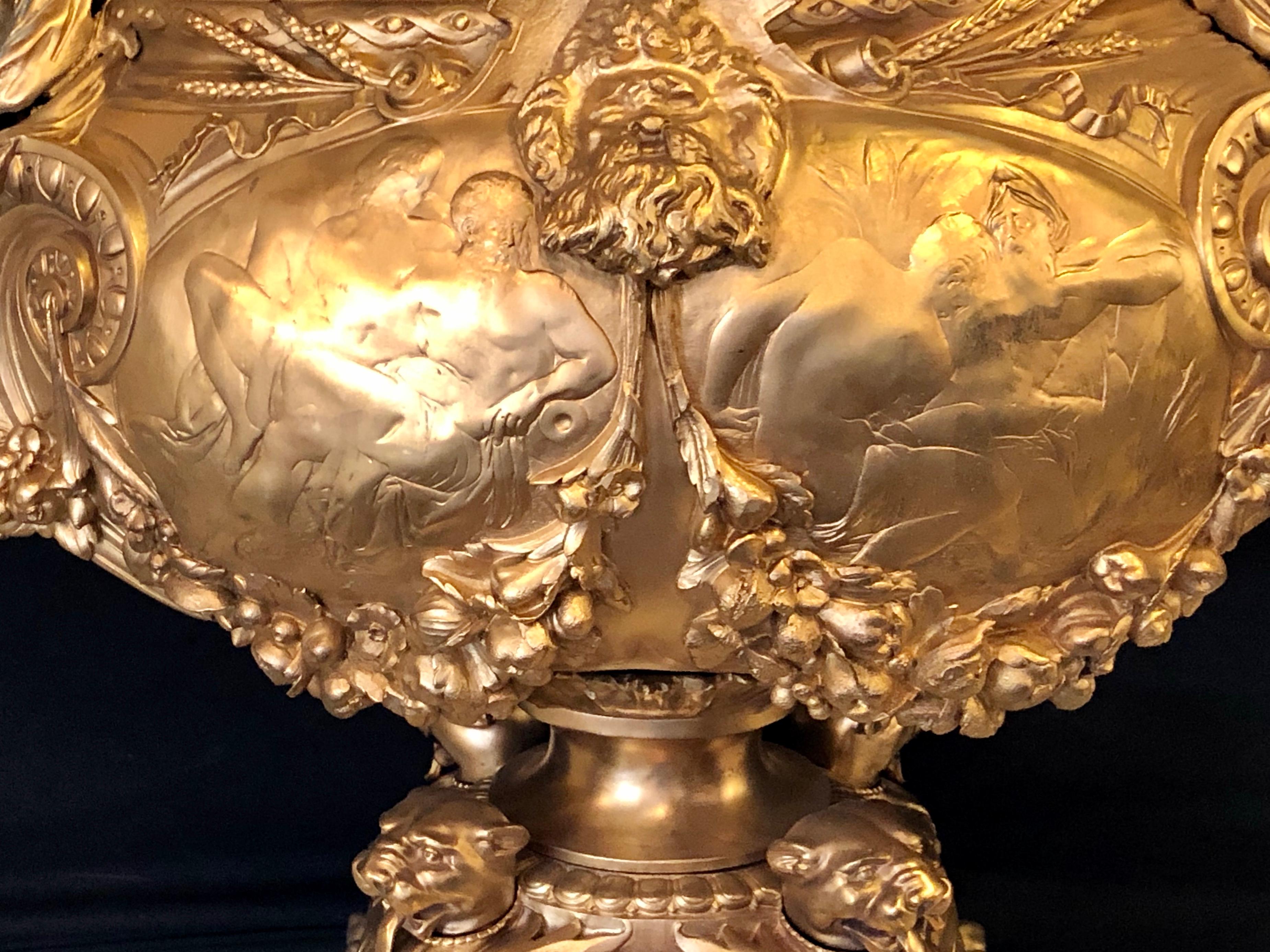 Bronze Louis XV style centerpiece, flowerpot, planter or jardinière. Seated with flaking maidens. This large and impressive centerpiece depicts a pair of seated full bodied maidens on each side of the open center pot with garland and floral design.