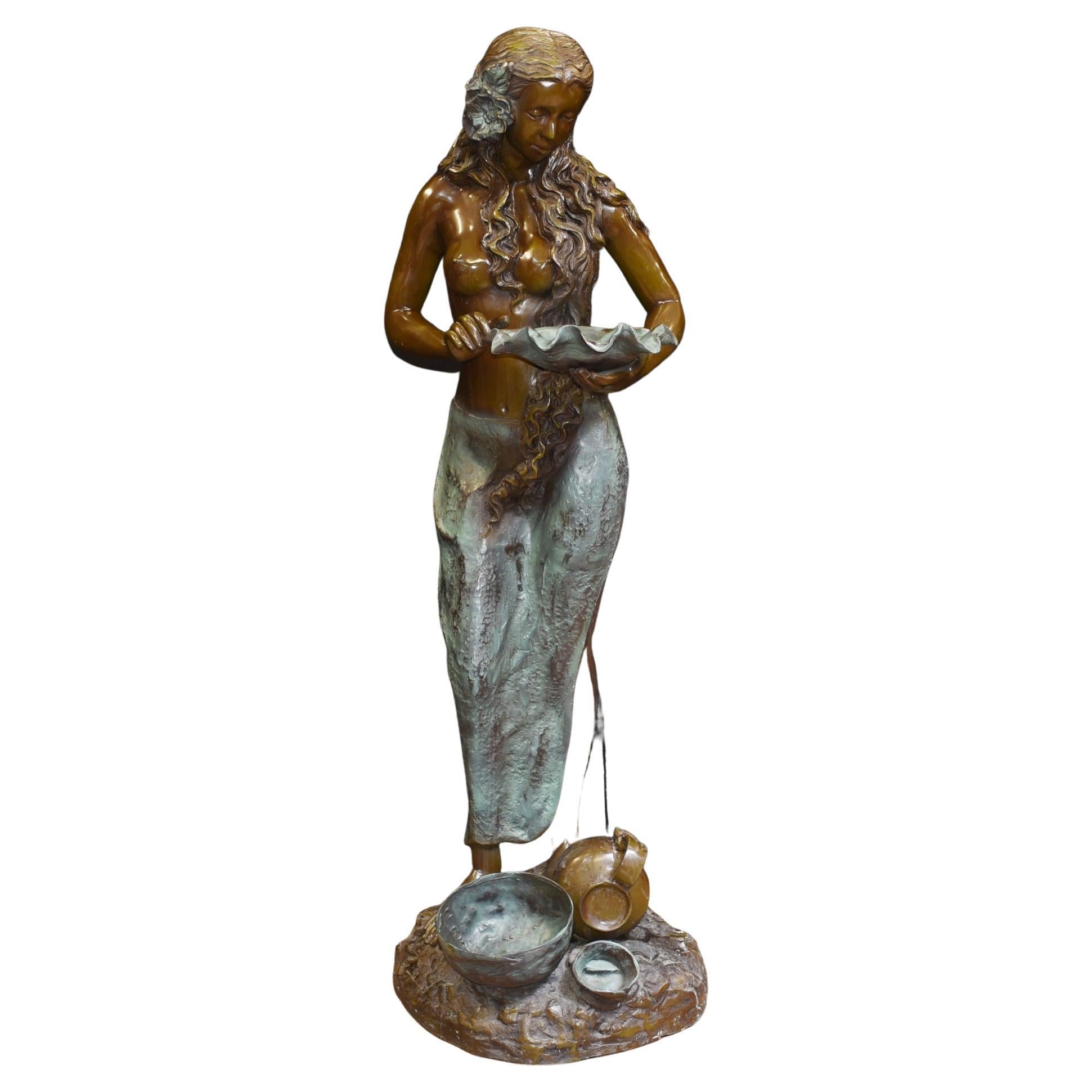 Elegant French bronze garden fountain in the form of a semi nude female
Good size at almost five feet tall - 149 CM
Easy to configure, water inlet is on the bottom at back of base
Imagine this configured with water cascading from the conch shell she