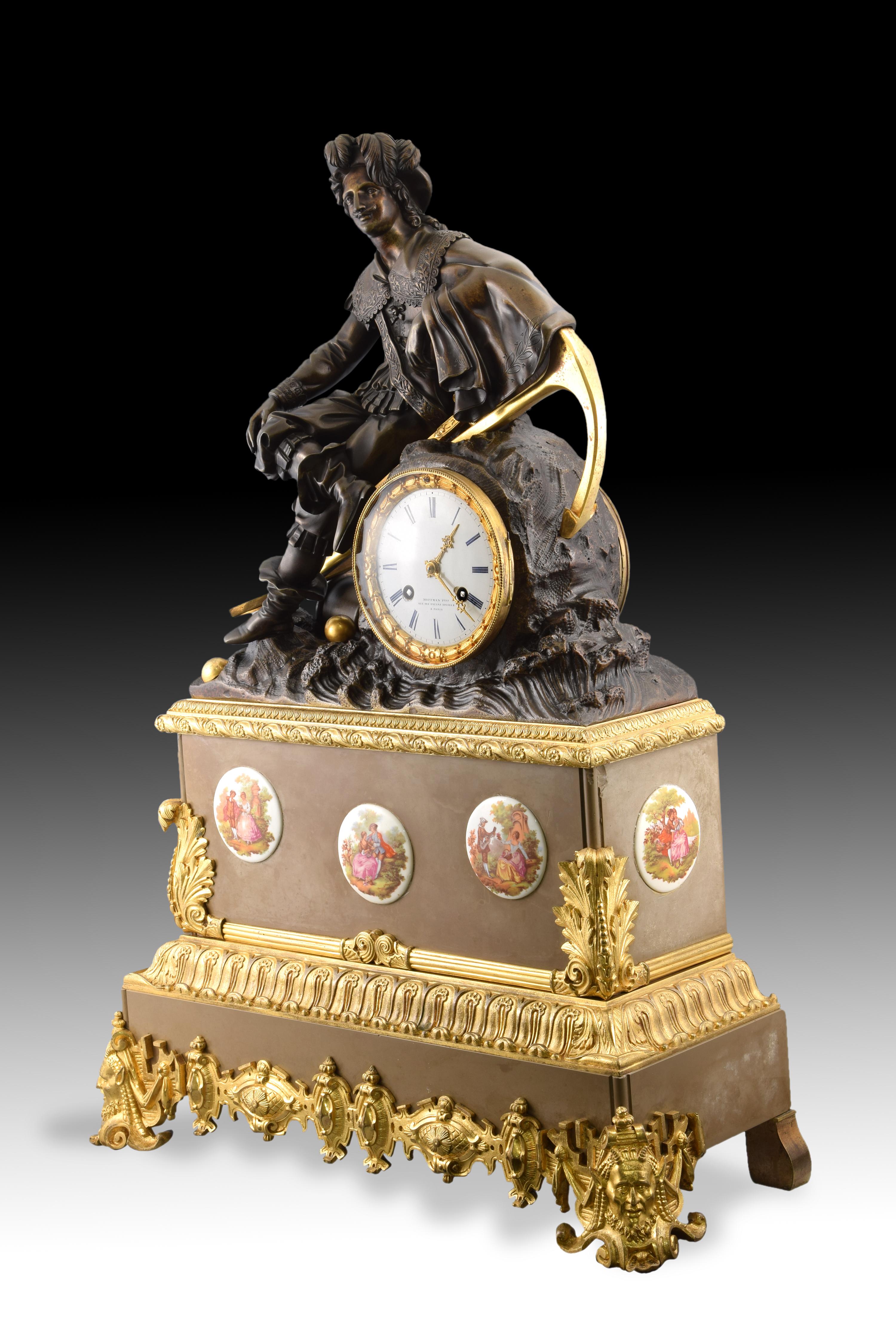Table clock. Marble and bronze, 19th century.
 Table clock with Paris box machinery made of marble and bronze and with porcelain plates applications with rococo souvenir scenes. The white dial features an inscription (Hoffman Fres. / Rues des enfans