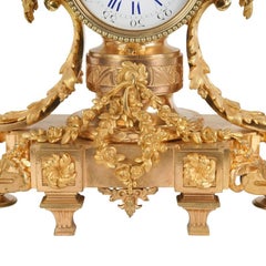 Reloj de sobremesa y candelabros de bronce, Francia. De G. Philippe