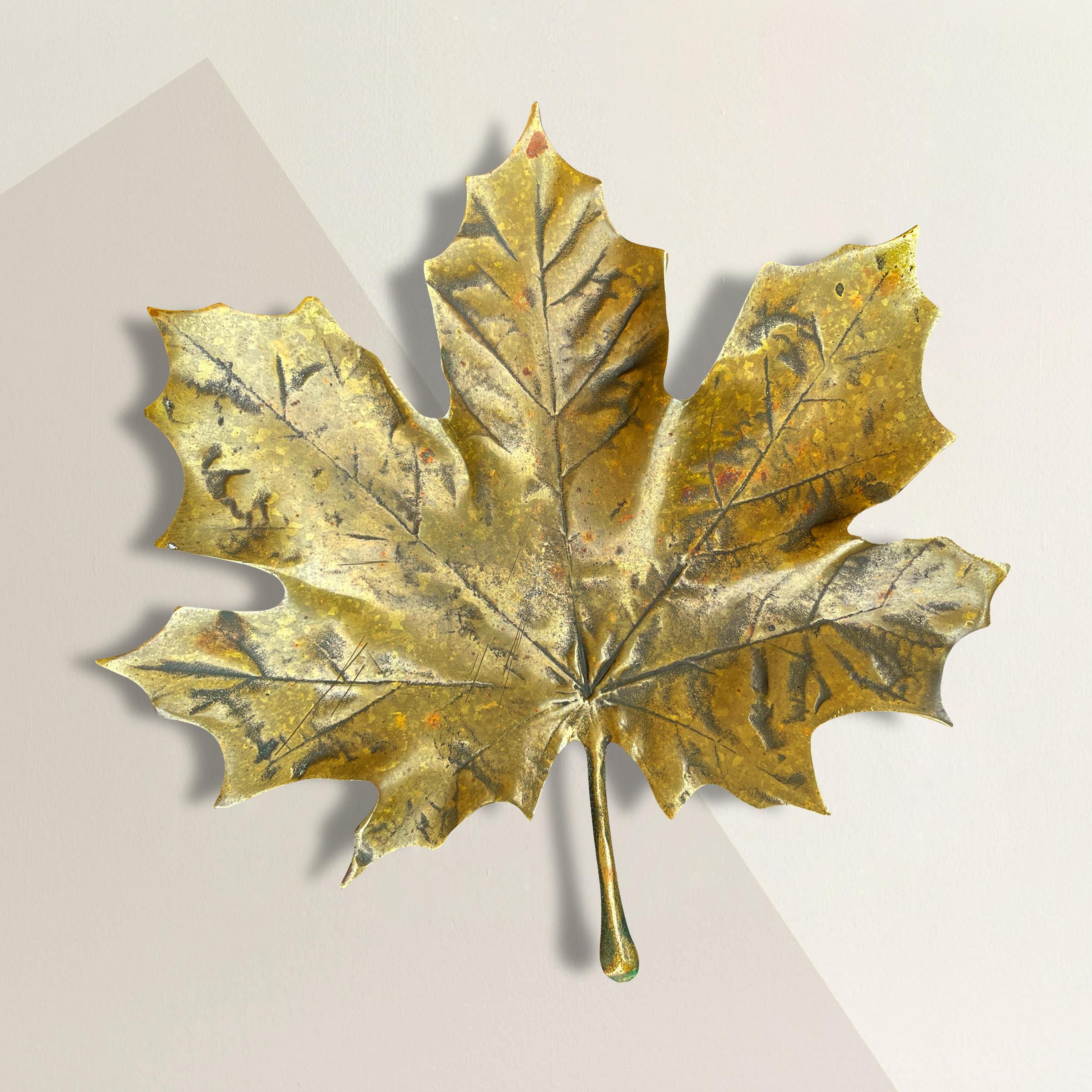 An incredible early-20th century American bronze maple leaf dish, cast from life, and with a wonderful patina only time can bestow on a piece of this age. Perfect for holding your keys, sunglasses, or pocket change on the table in your entry!