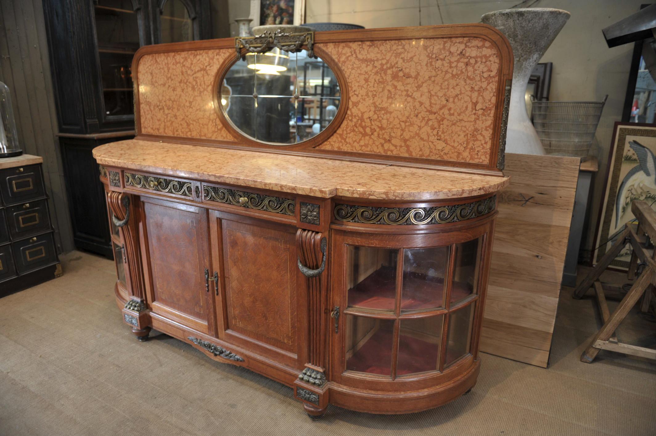 Great quality Louis XVI style sideboard in oak marquetry, curved sides doors with original beveled glass and marble top and bronze ornements. Height without top part 104 cm (49.94 inches).
 