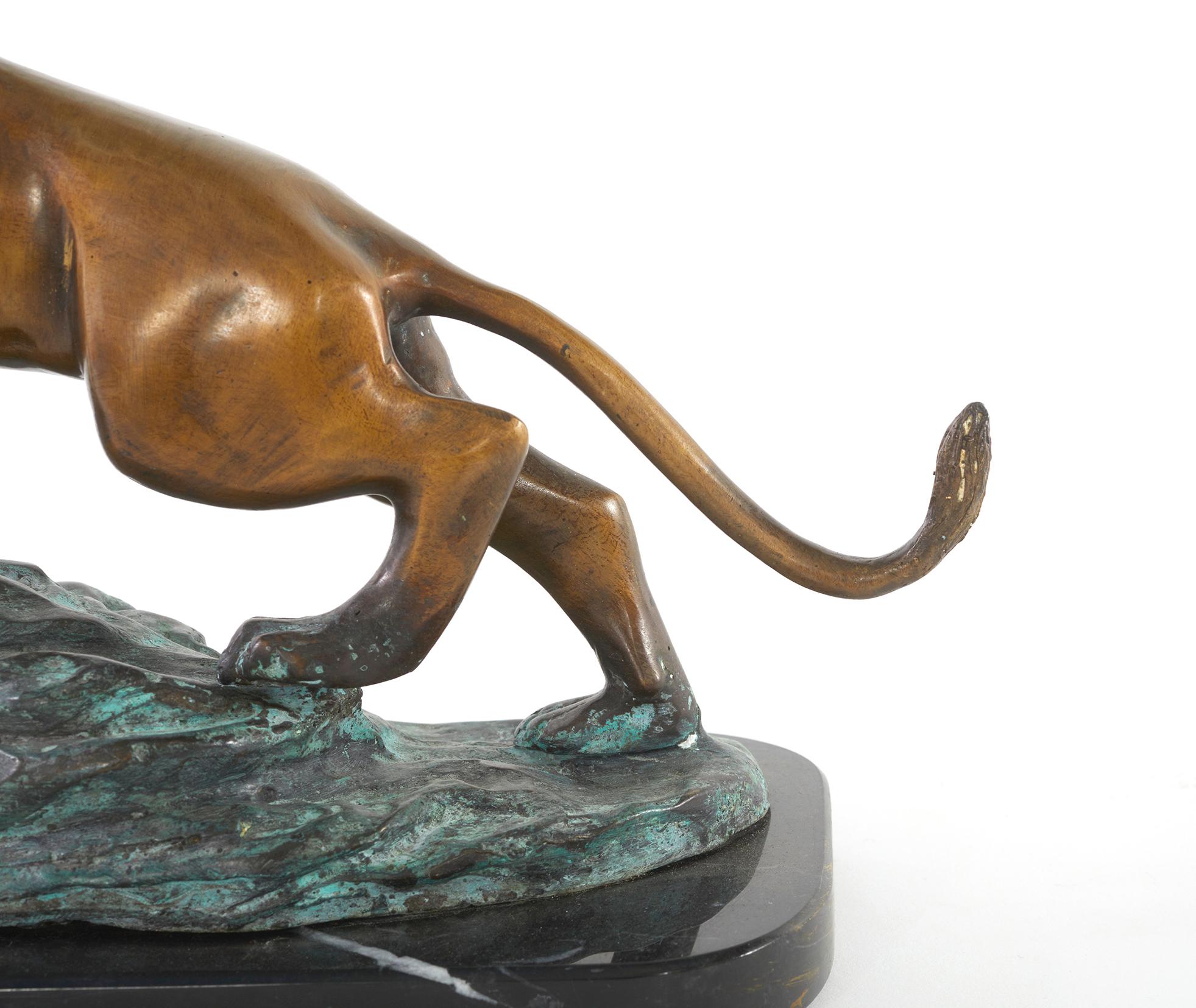 Early 20th century Art Nouveau style gilt bronze / black marble base lion sculpture decorative piece. The piece is in great condition. Minor wear consistent with age / use. Maker's mark inscribed. The piece stand about 11 inches tall X 11.5 inches