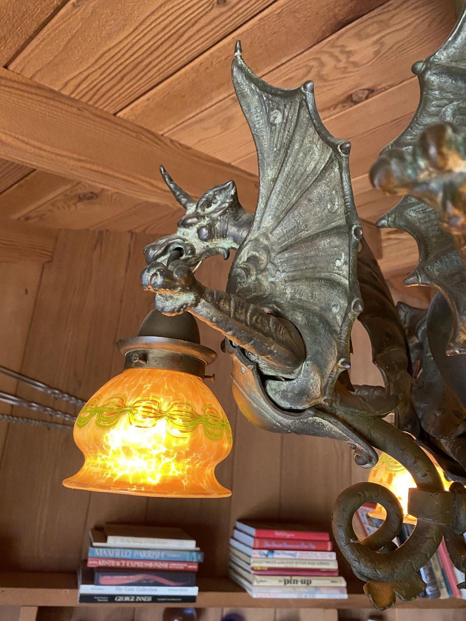 Early 20th Century Bronze Medieval Dragon Chandelier w/ Quezal Gold Iridescent Shades For Sale