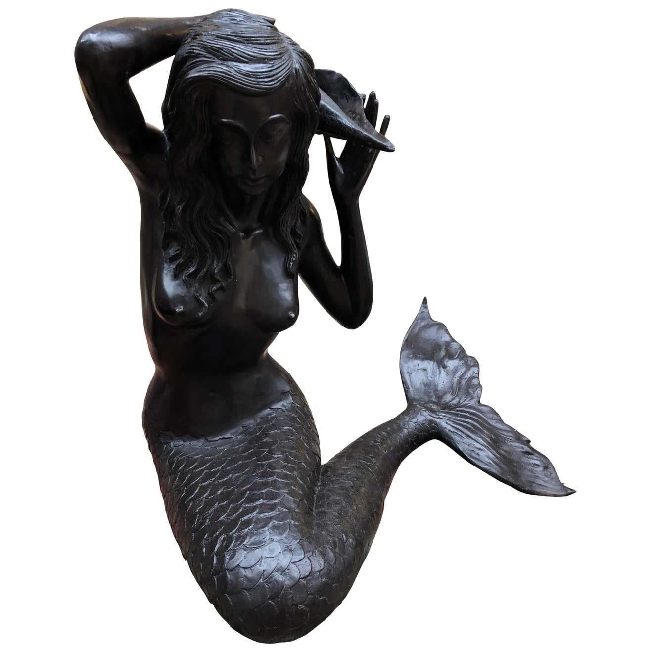 A fantastic bronze mermaid fountain garden statue siren female figurine, 20th century. Cast from bronze with lovely patina. Of course being bronze this can live outside with no fear of rusting. Piece is a fountain, the inlet tube is under her fin