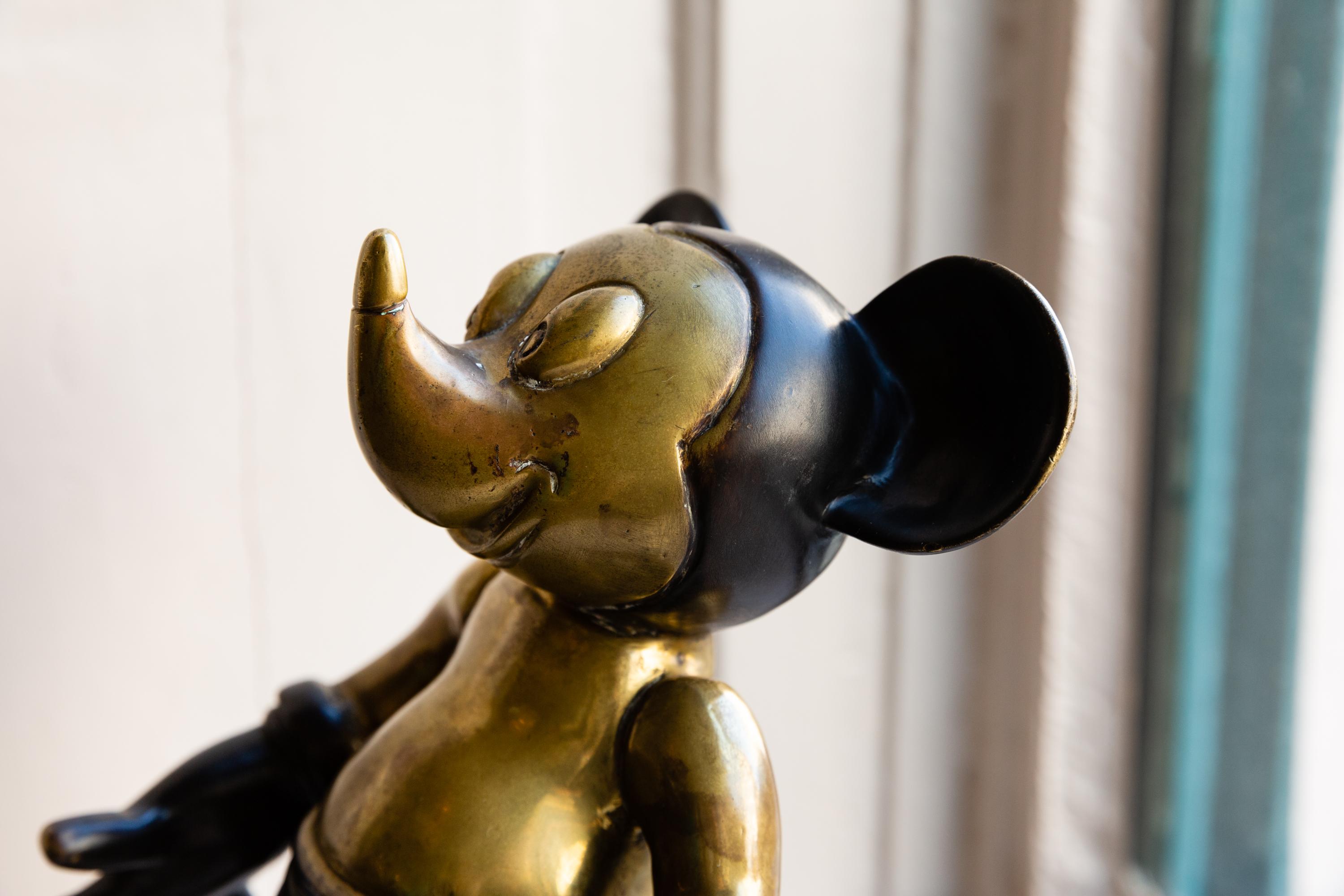 wooden mickey mouse statue