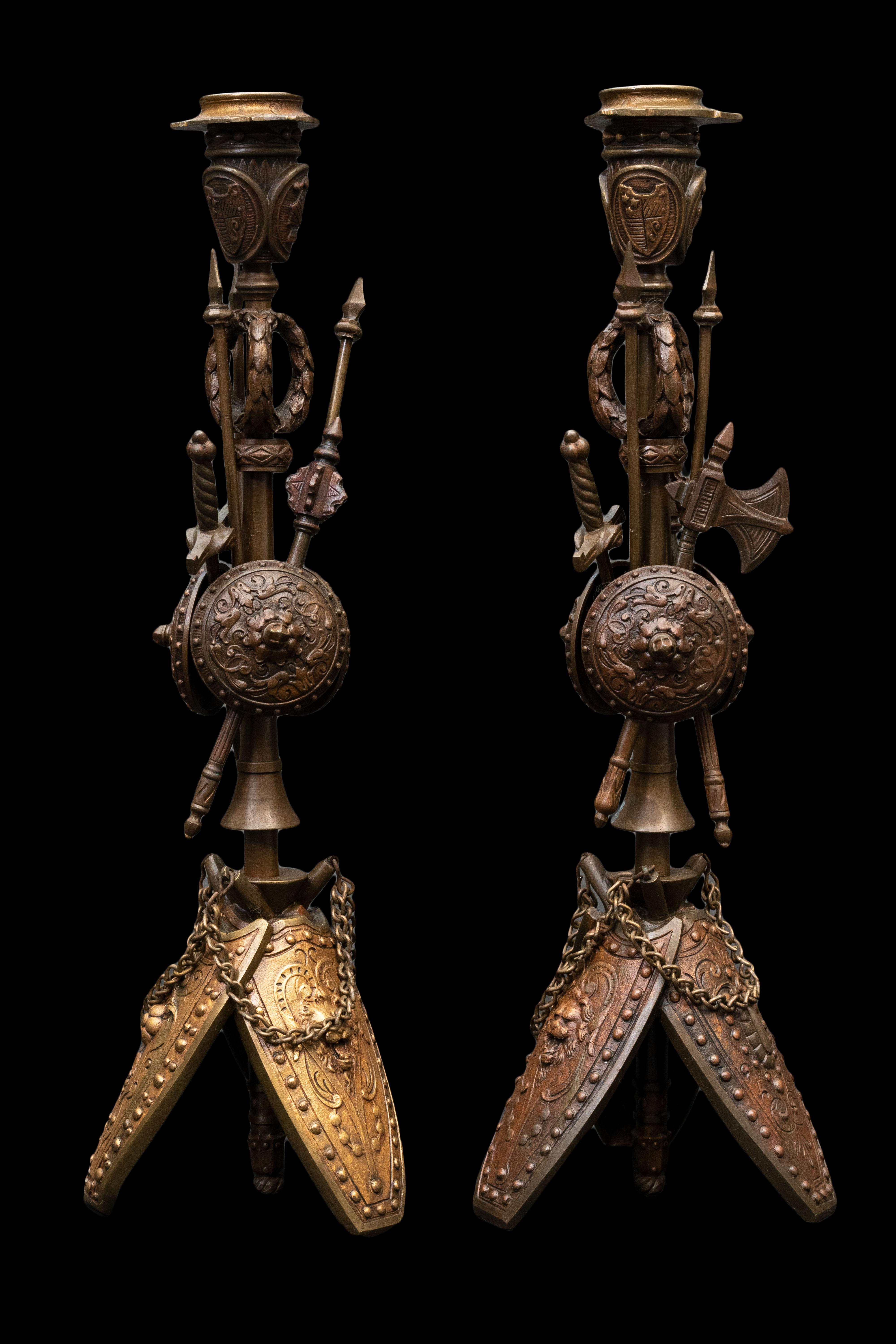 A pair of patinated bronze military candlesticks.

Measures Approximately: 4