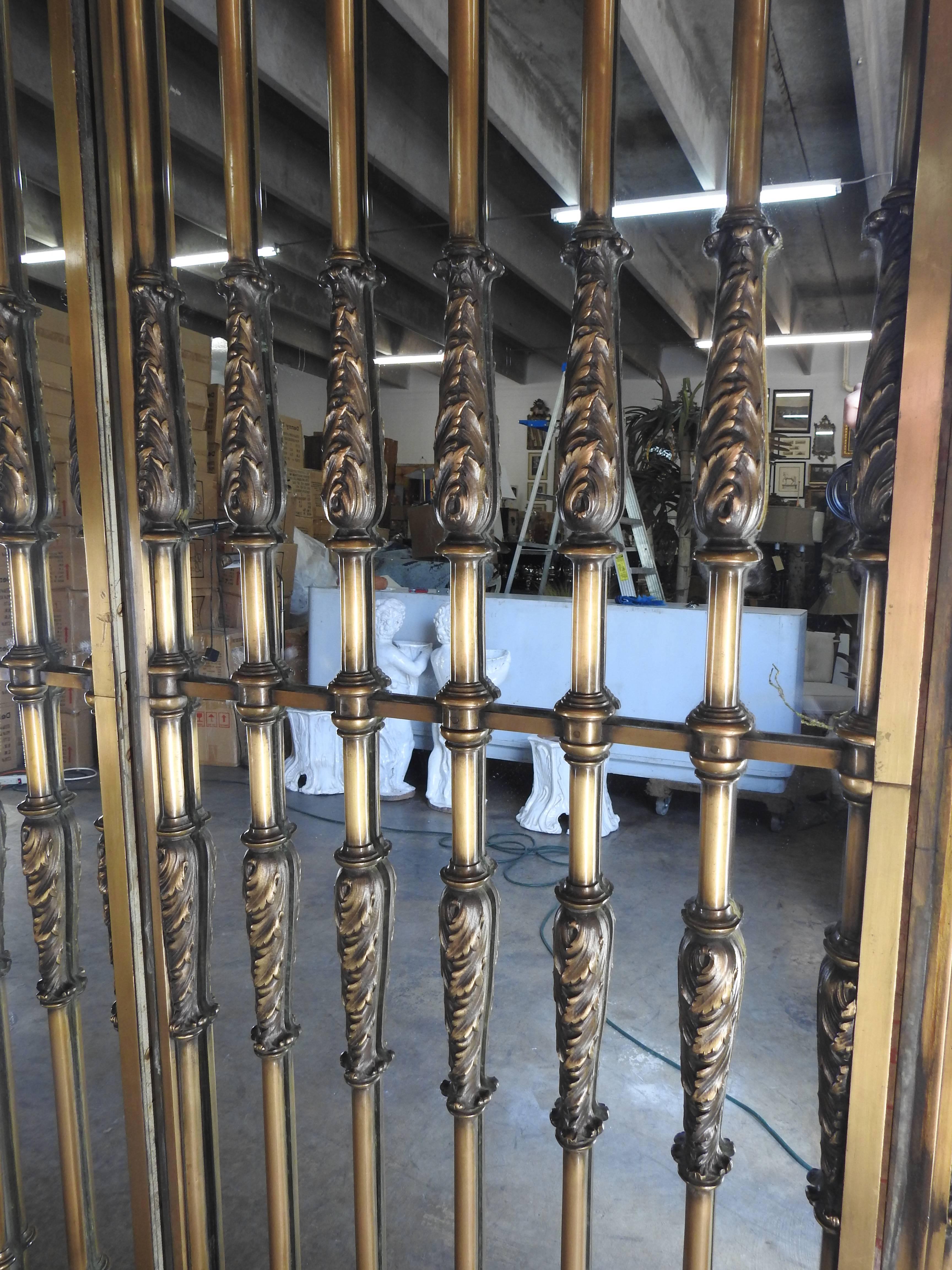 This bronze and mirrored wall is a sight to see. It has been attributed to the master metal worker Samuel Yellin (1884-1940) and was originally in a bank in Philadelphia. Right at 20 foot long all the bronze work on this piece is spectacular. This