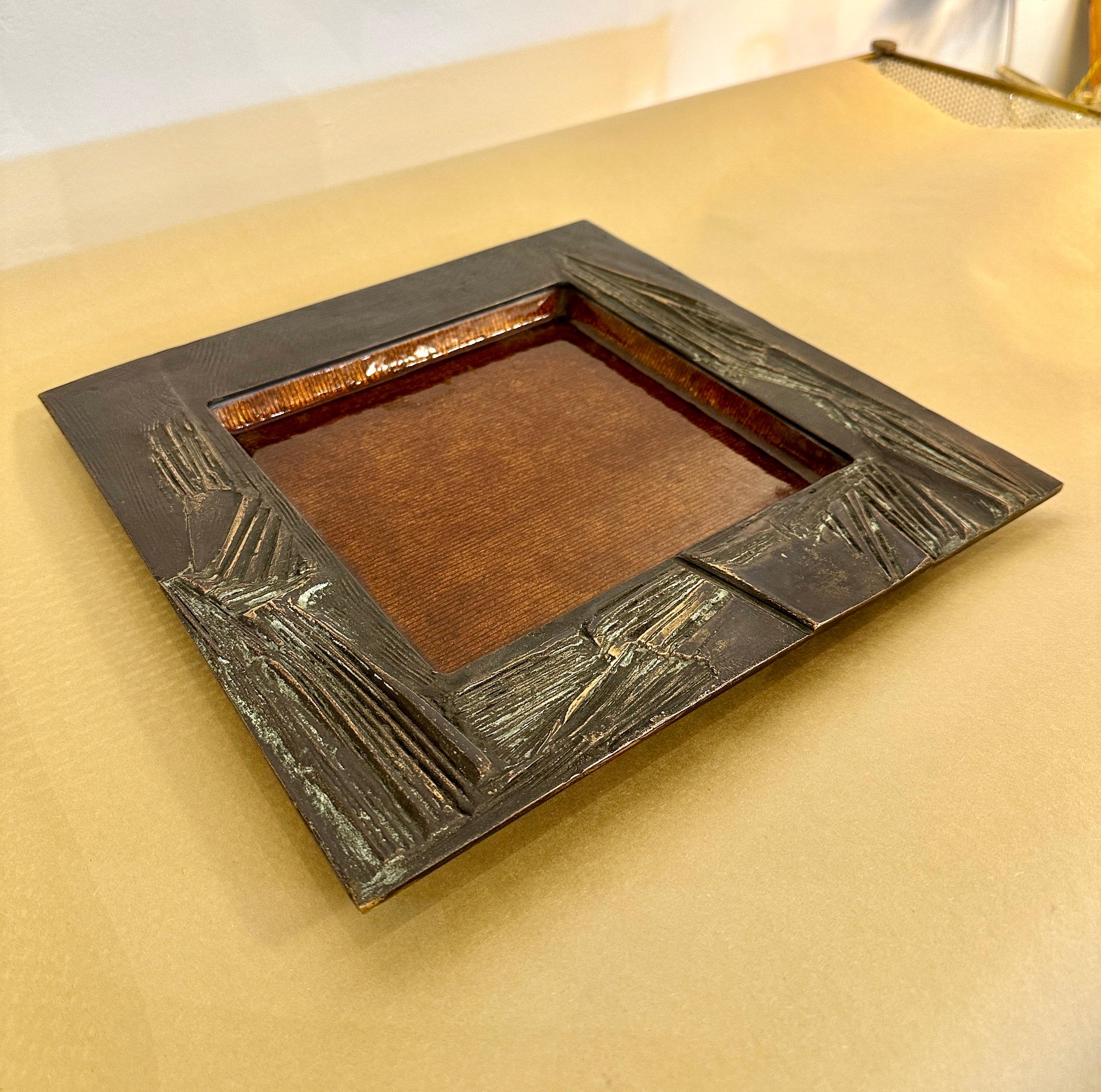Raised sculptural texture adorns this brutal style bronze square bowl with an interior enamel finish. Excellent patina and very heavy - SIGNED to verso.  THIS ITEM IS LOCATED AND WILL SHIP FROM OUR EAST HAMPTON, NY SHOWROOM.