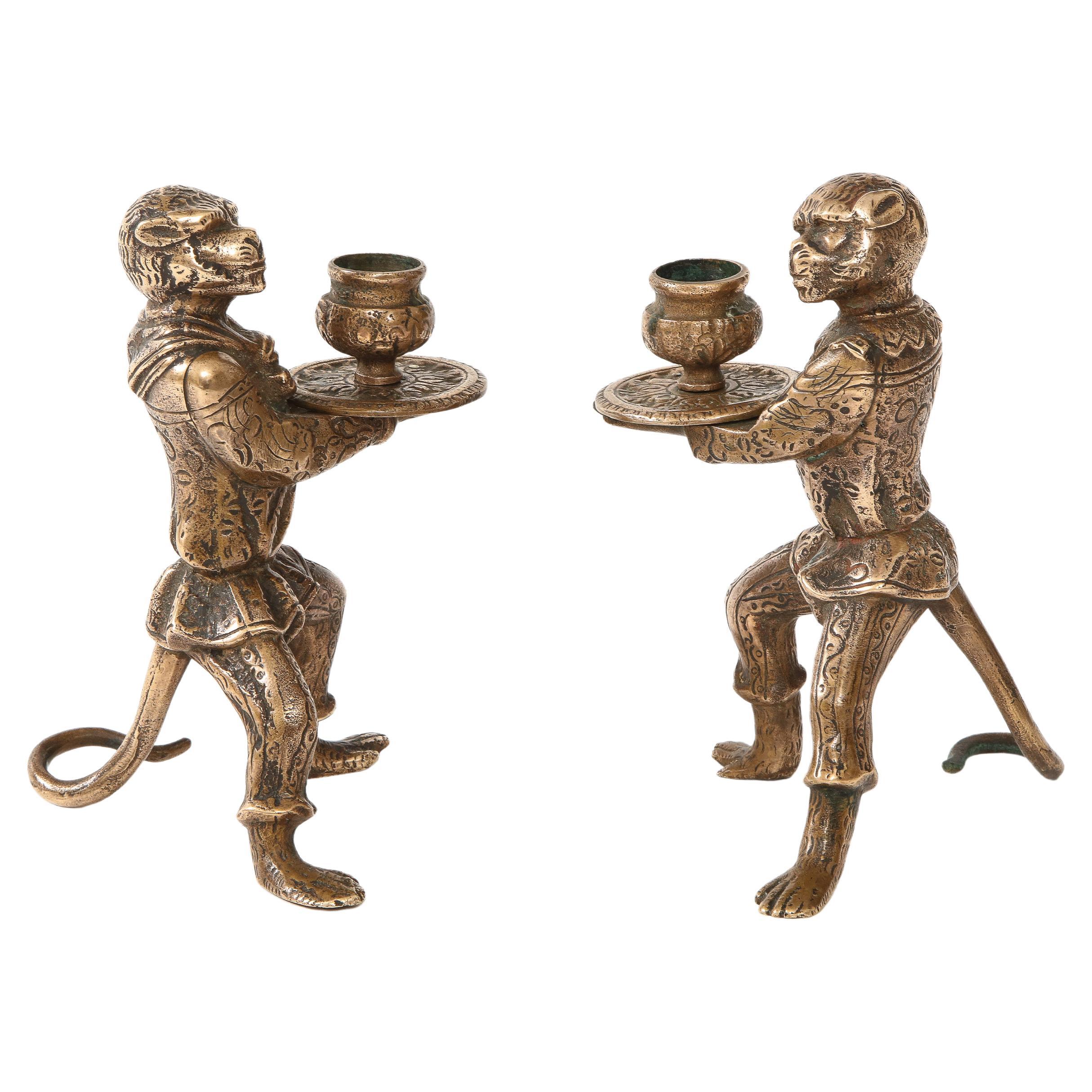 Beautiful pair of 1930s French bronze monkey candle holders, in vintage condition lightly hand polished with some wear and patina due to age and use.