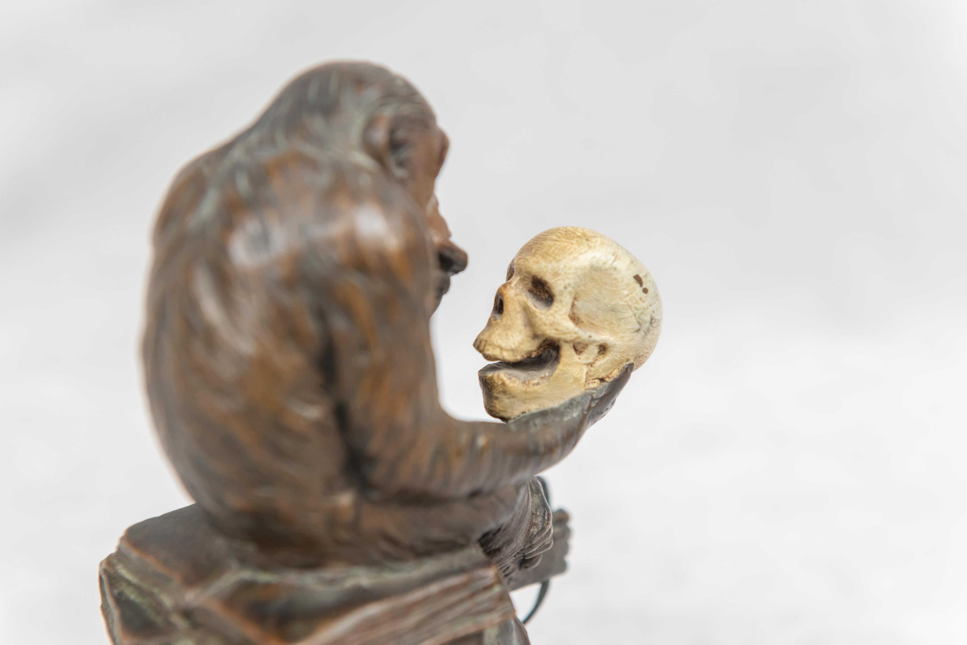 monkey holding skull meaning