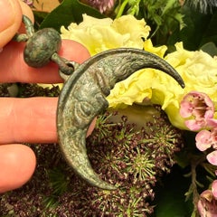 Bronze moon pendant with anthropomorphic face. Finland or Gotland, 14th century.