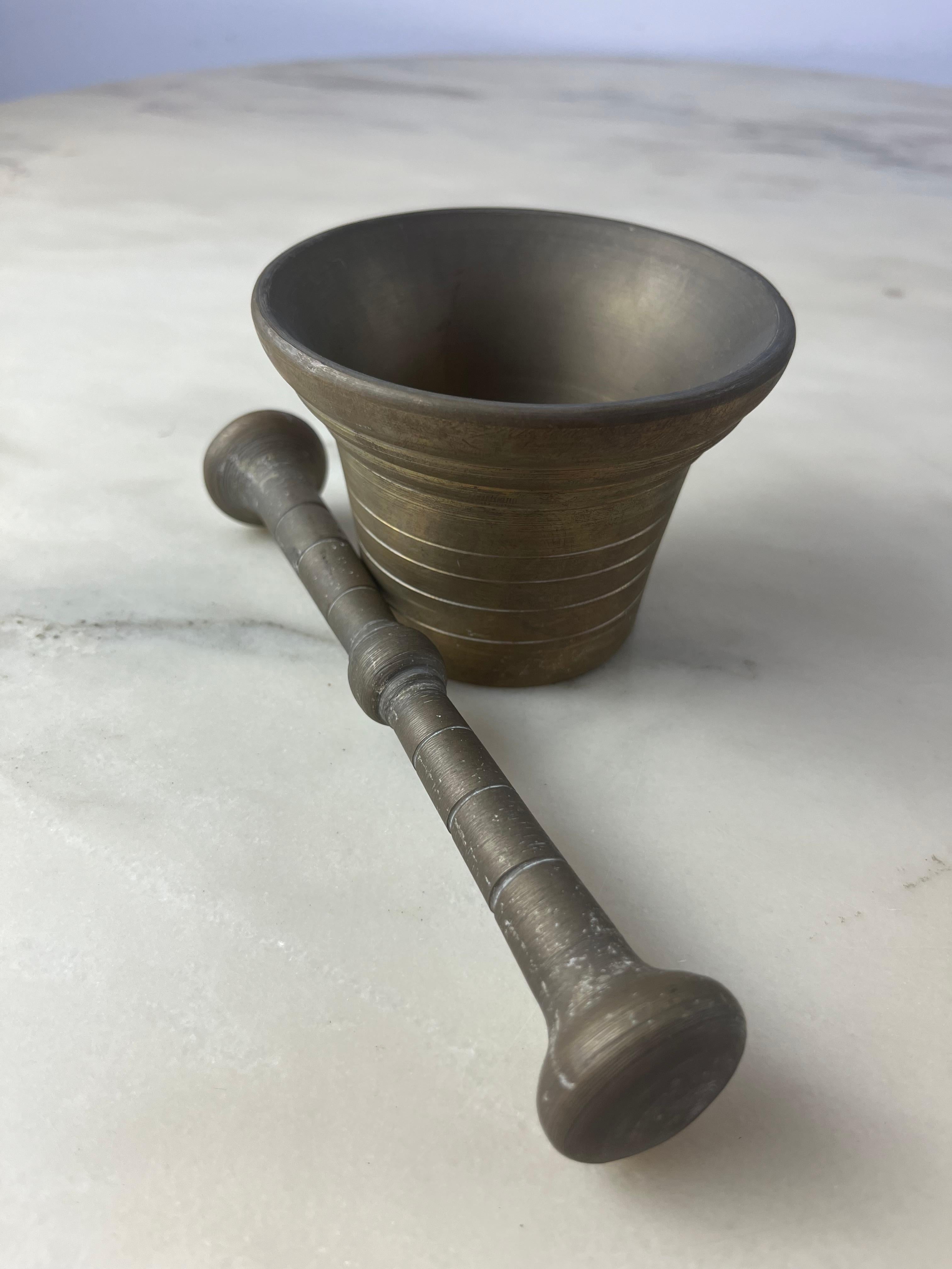 Bronze mortar and pestle, Italy, 1950s
Found in a country house. Good conditions. The mortar has a height of 8 cm and a diameter of 10 cm. The pestle is 18 cm long.