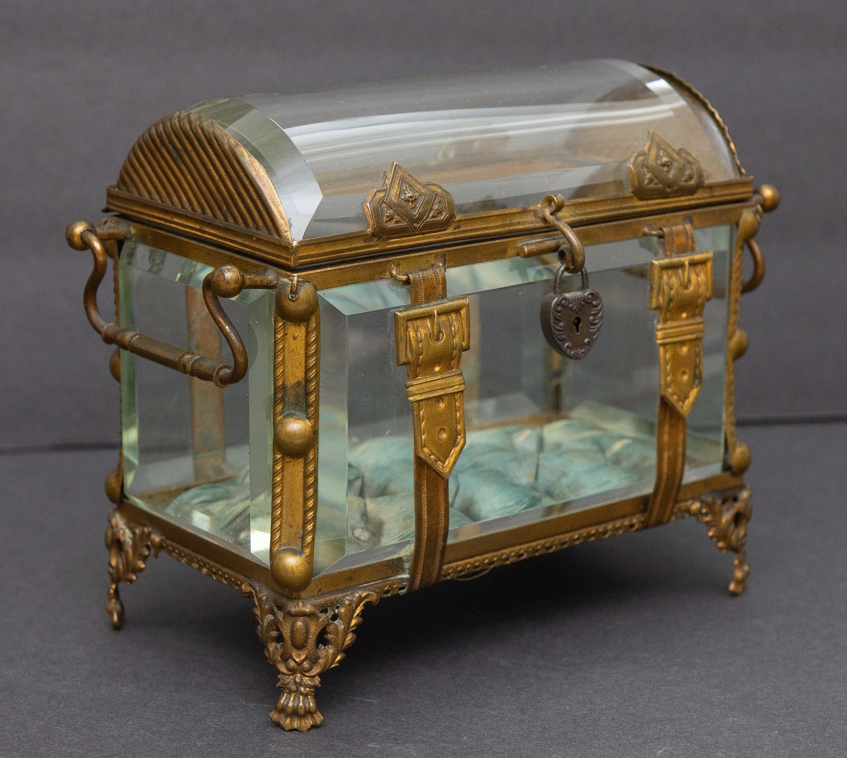 Antique decorative beveled glass with gilt bronze mounts. Curved glass top. With sterling locket. Original blue silk interior.
Presented by Joseph Dasta Antiques.