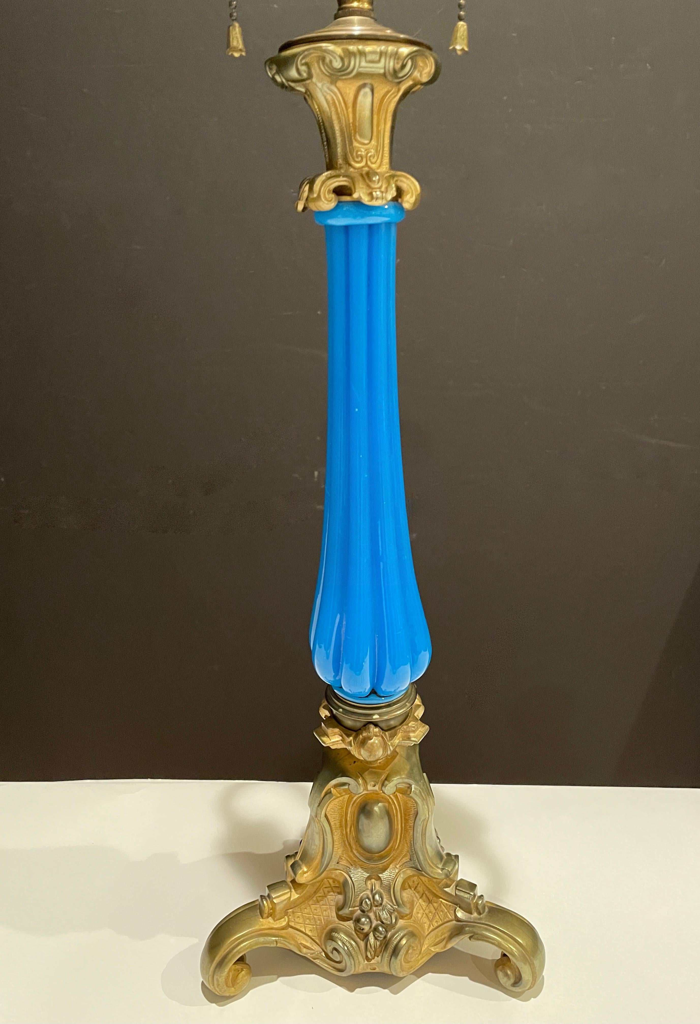 19th century French gilt bronze mounted blue opaline lamp. Blue opaline fluted glass column with decorative bronze base and cap.