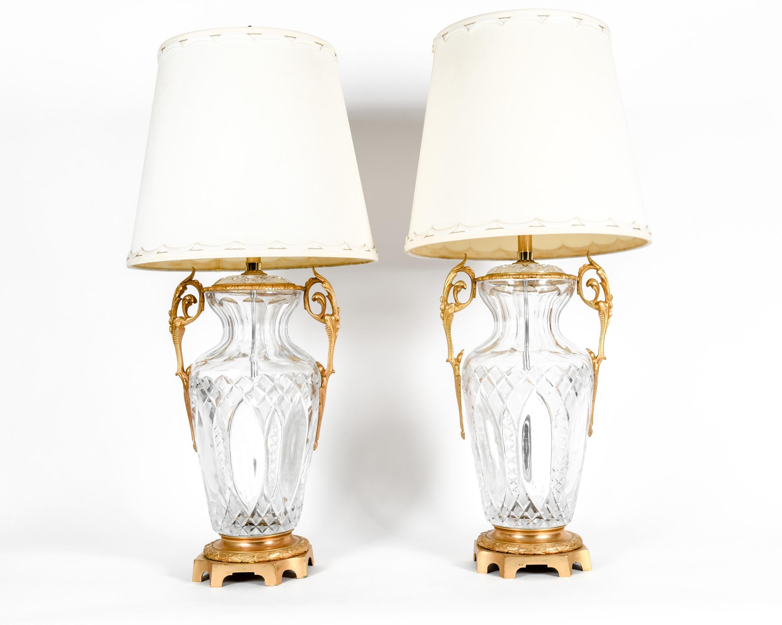 Bronze-mounted with cut crystal pair early 19th century table lamps. Each lamp is in excellent antique working condition. No special light bulb required. Rewired for US use, minor wear consistent with age or use. Measures: Each lamp stand about 38.5