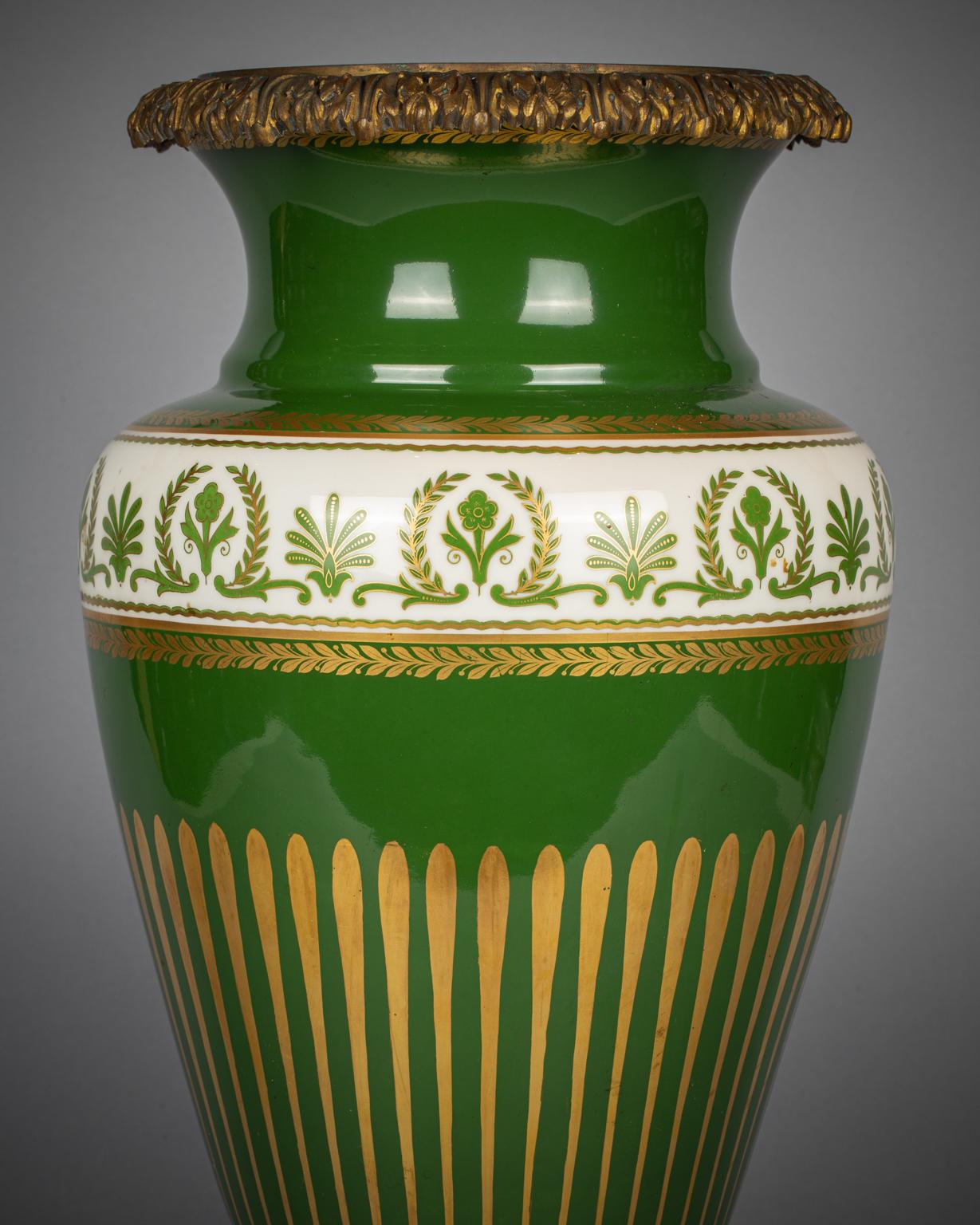 Beautifully hand painted green white design with lovely gilt accents. Ornate bronze mounts at top of the vase as well as the base. Limoges Depose France mark at bottom.