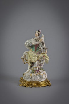 Bronze Mounted German Porcelain Figure of a Lady with Dog, Meissen, circa 1750