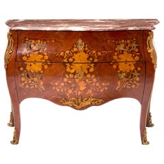 Cómoda decorada con marquetería de madera de rey estilo Luis XVI montada en bronce