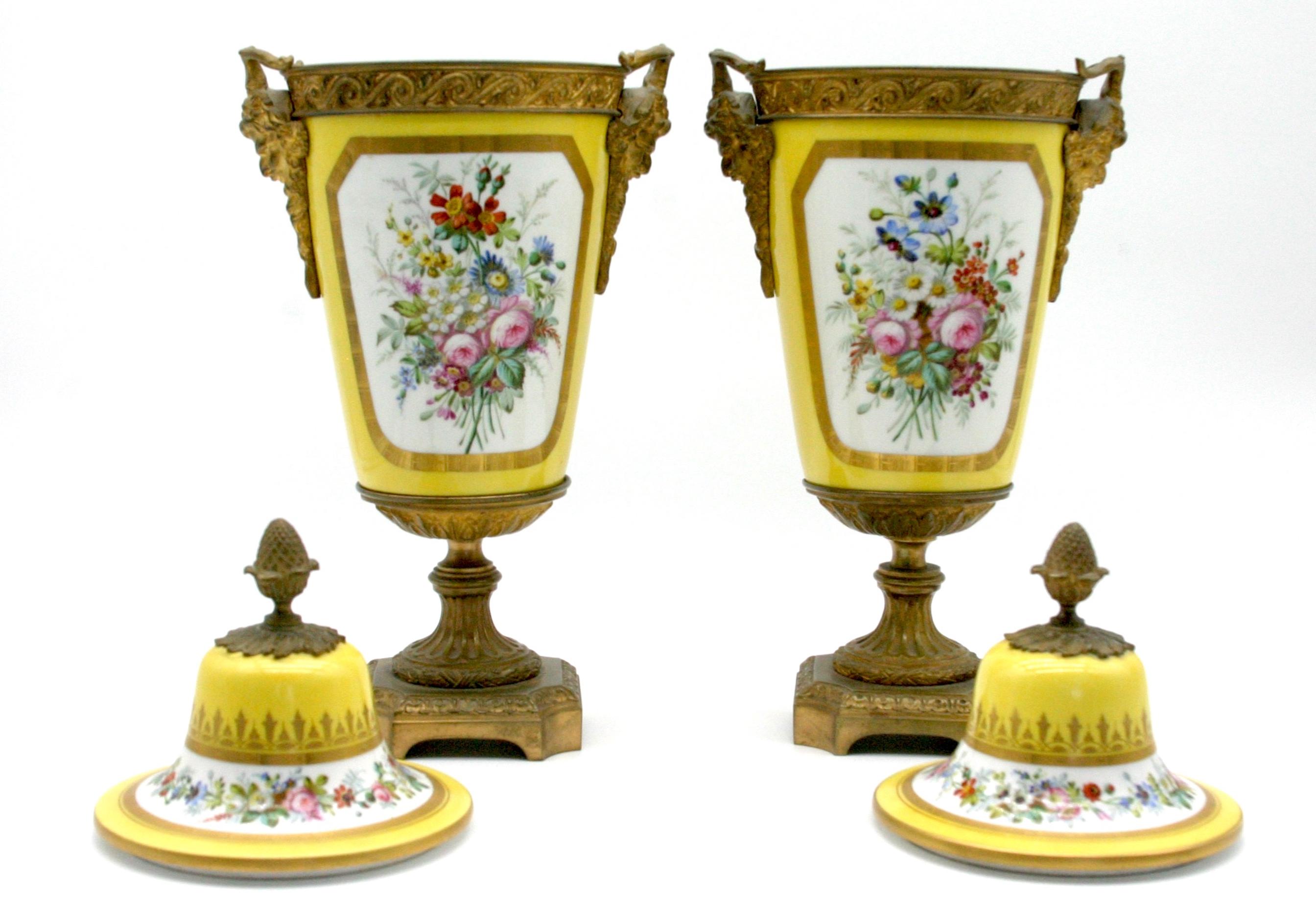 19th Century bronze mounted pair porcelain decorative urns with exterior hand painted romantic scene and floral details. Artist signature 