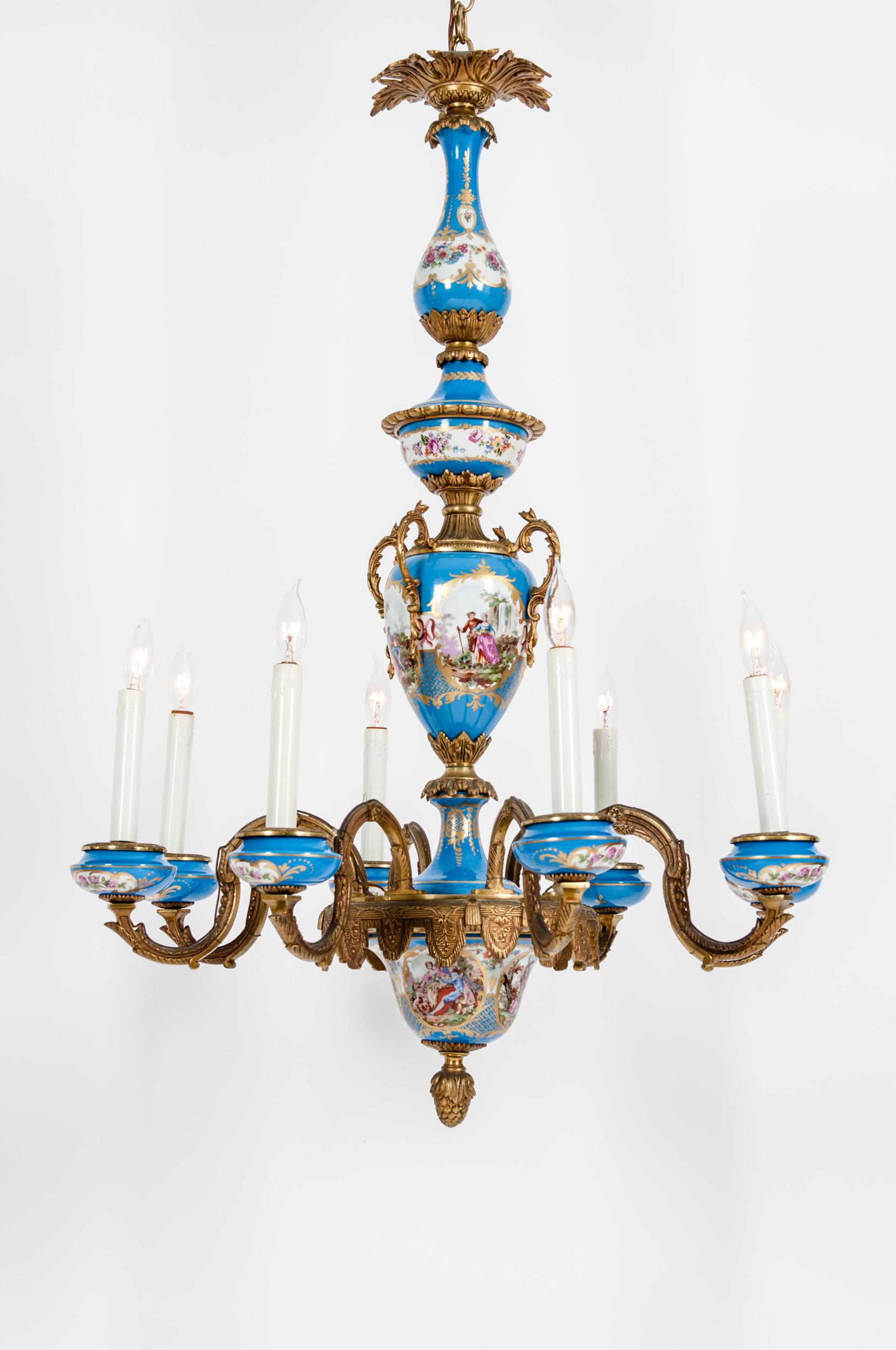 Bronze mounted / Sevres porcelain seven arm chandelier with exterior design details . The chandelier in in great working condition . Minor wear appropriate with use / age . Rewired for US use , no special light bulb required . The chandelier measure