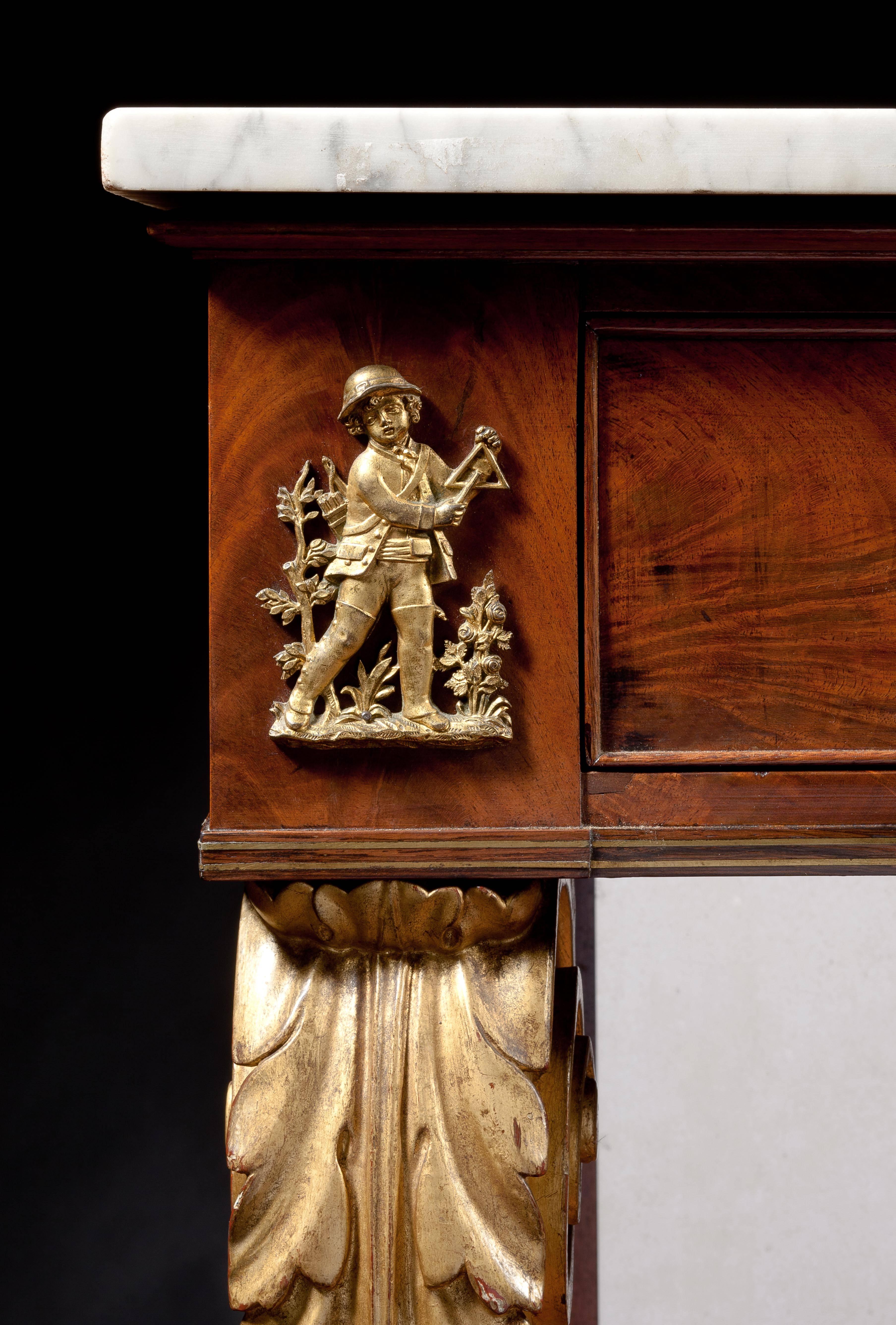 Attributed to Duncan Phyfe (1770-1854)
New York, circa 1825

The white oblong marble top above a conforming case with a blind cock-beaded frieze drawer flanked by ormolu appliqués of a boy and girl playing musical instruments. The case bottom