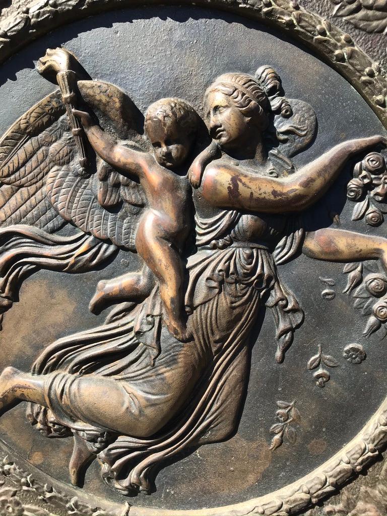 The original reliefs night and day were executed by Thorvaldsen in 1815. Day personified flies actively across the sky with her head held high. She looks over her shoulder and fixes her gaze on the small torch-bearing boy here proudly symbolizing