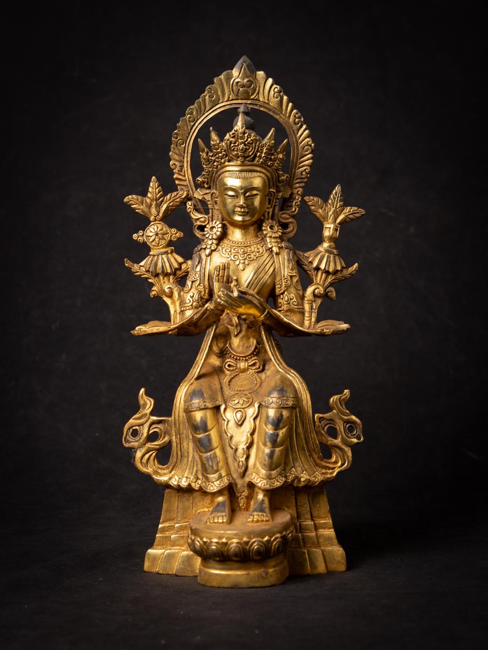 Bronze Nepali Maitreya Buddha statue

Material : bronze
31,7 cm high
14,7 cm wide and 13,4 cm deep
Dharmachakra mudra
Recently made (not antique)
Weight: 1,96 kgs
Originating from Nepal