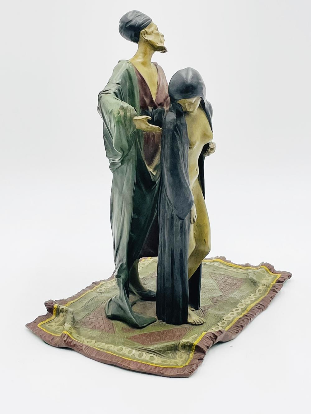 Sustantial bronze sculpture by Austrian artist Franz Bergman depicting a Man holding a nude female and standing on a rug.

Beautiful colors and attention to detail.

Signed.

Measurements:
11.25 inches high x 10 inches wide x 7 inches