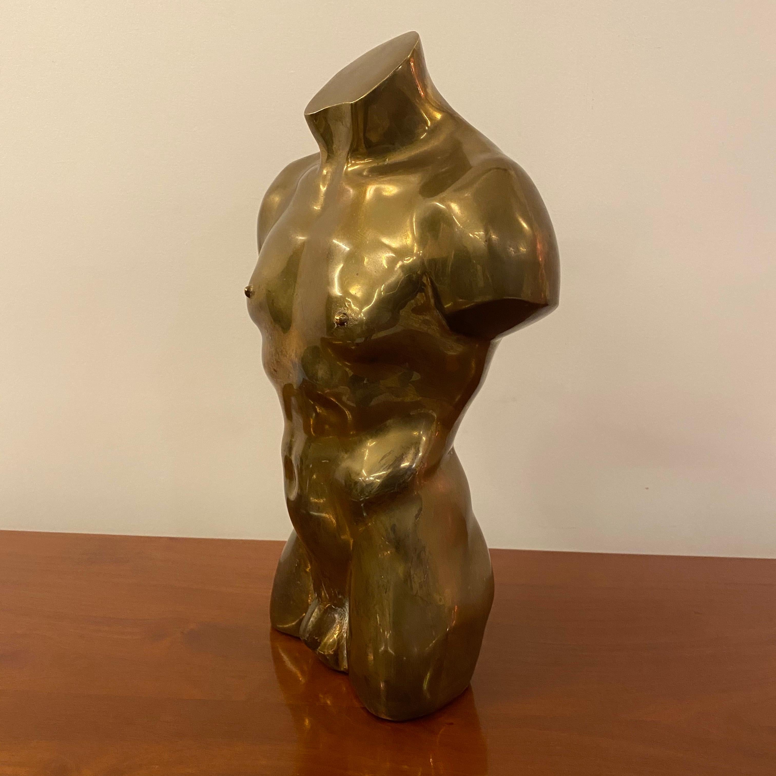 A beautiful bronze piece who represents a nude male torso, popular style in the 1970s.
This Greco Roman style sculpture will add an antic style to any contemporary or traditional place to live.
Brownish patina for this piece of Art.
