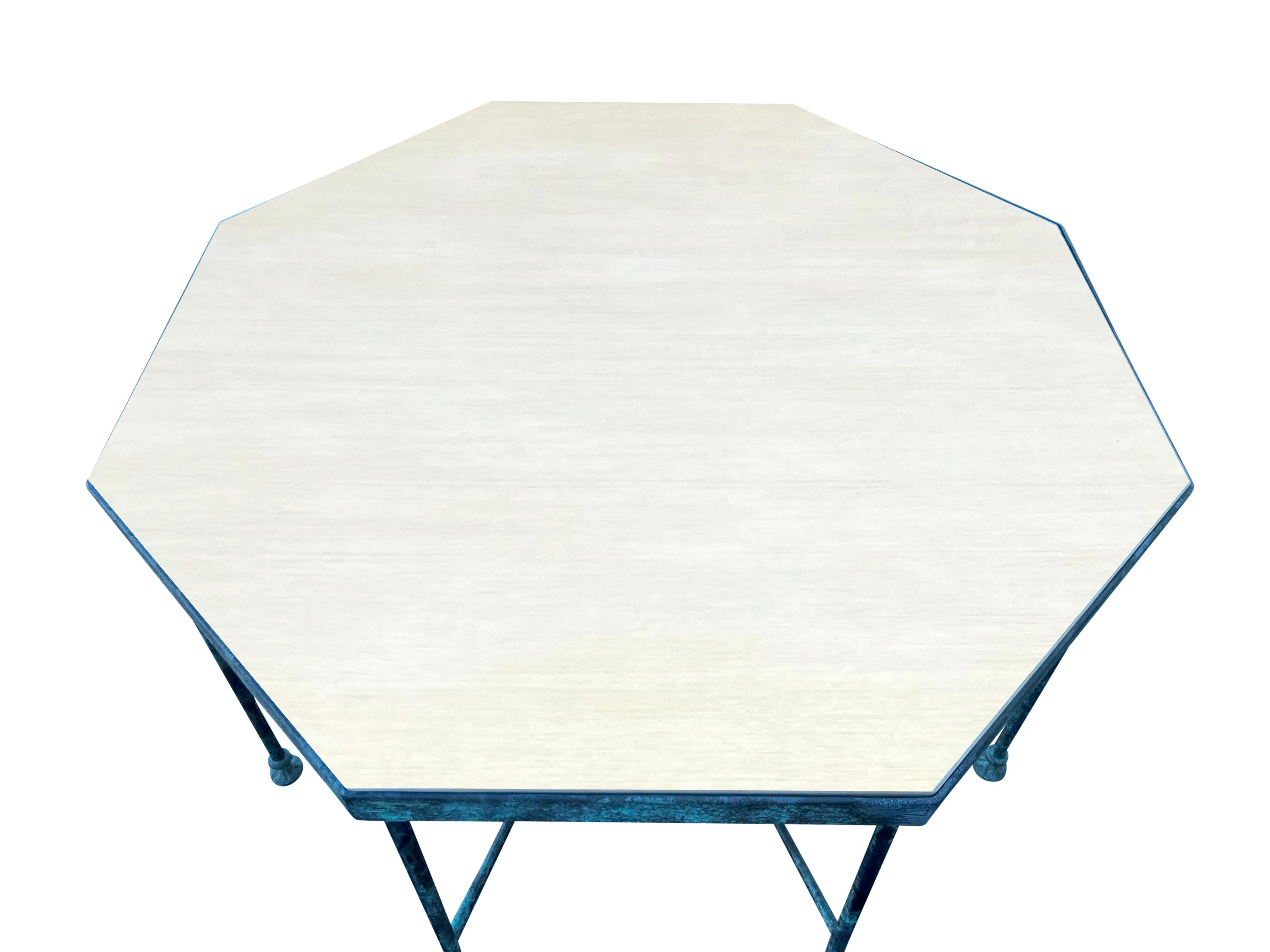 By Chelsea Textiles. With octagonal veneered plywood top set in a conforming frame with eight circular legs joined by eight spokes and button feet. This has been inspired by the original table commissioned by Diego Giacometti ]1902-1985] by Hubert