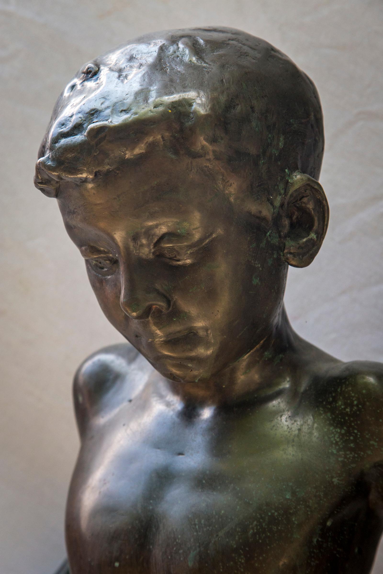 This fully nude statue of a young boy is signed on the back of the rock upon which he stands.
V. Alfano
Vincenzo Alfano 1854- circa 1917 Naples, Italy
The integral base is almost square. The height shown is overall.
 